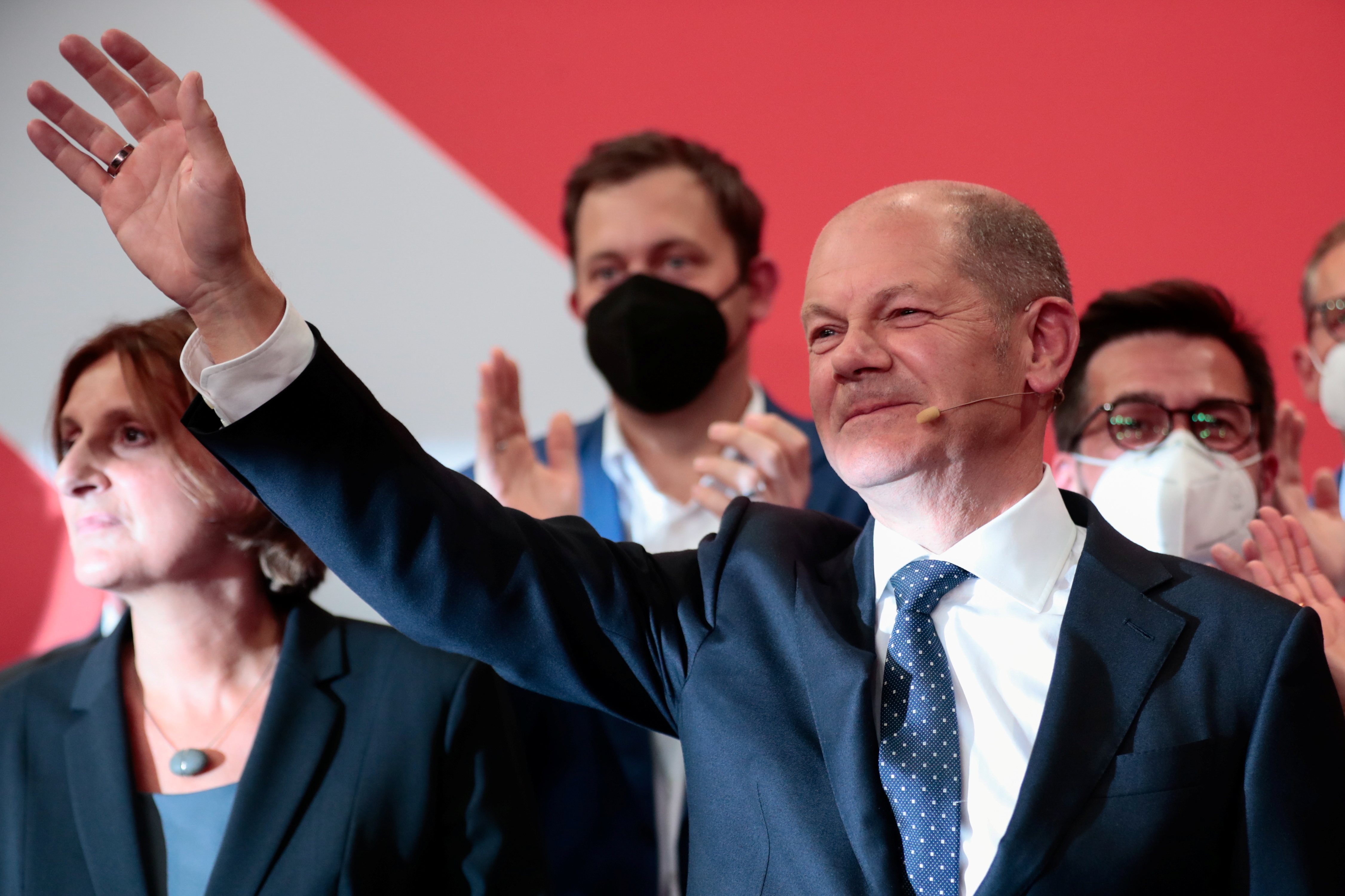 Reactions to the first exit polls from Social Democratic Party candidate Olaf Scholz and supporters at the party headquarters