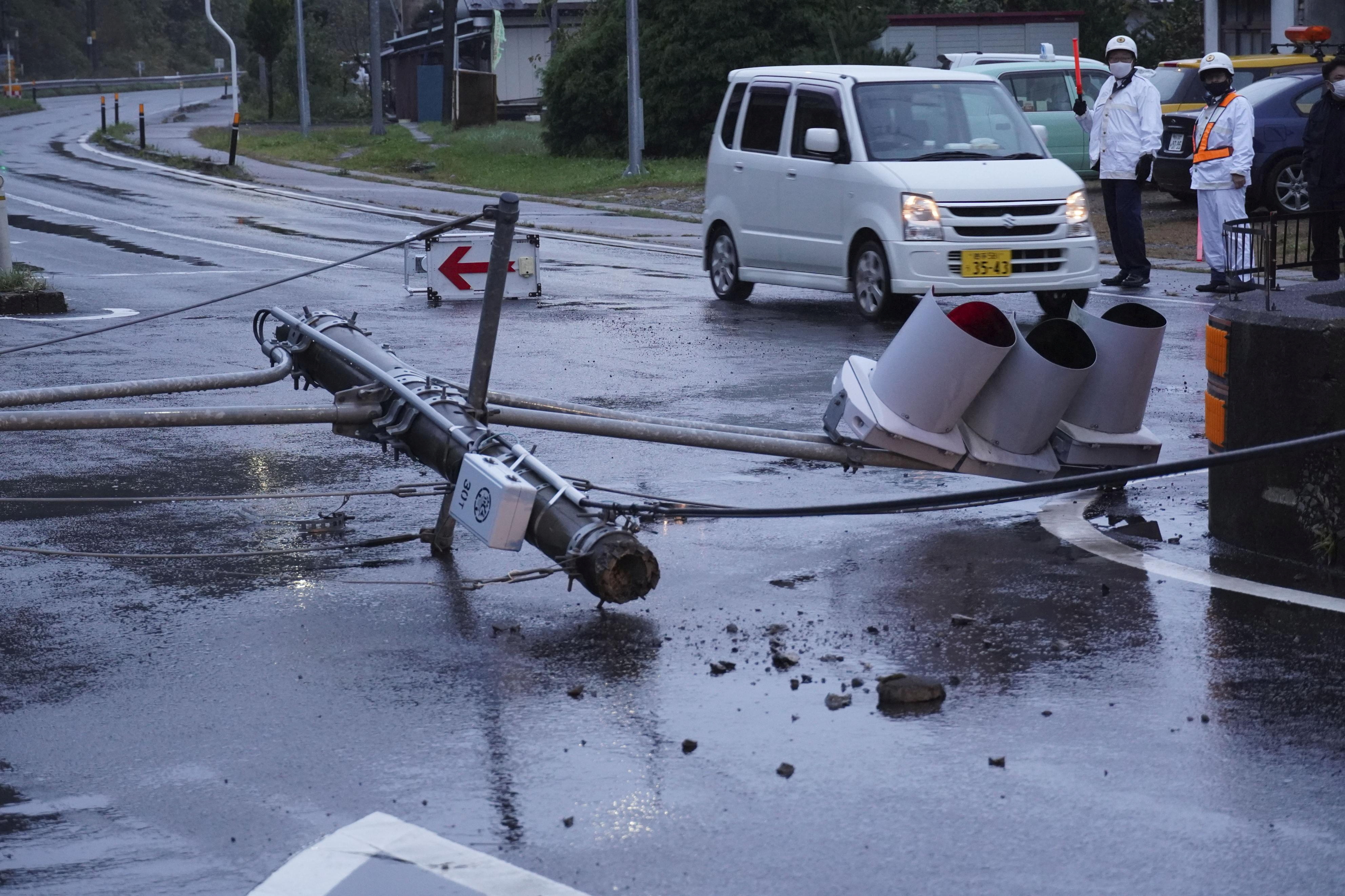 Damaged traffic lights are seen on the road after an earthquake hit Iwate town