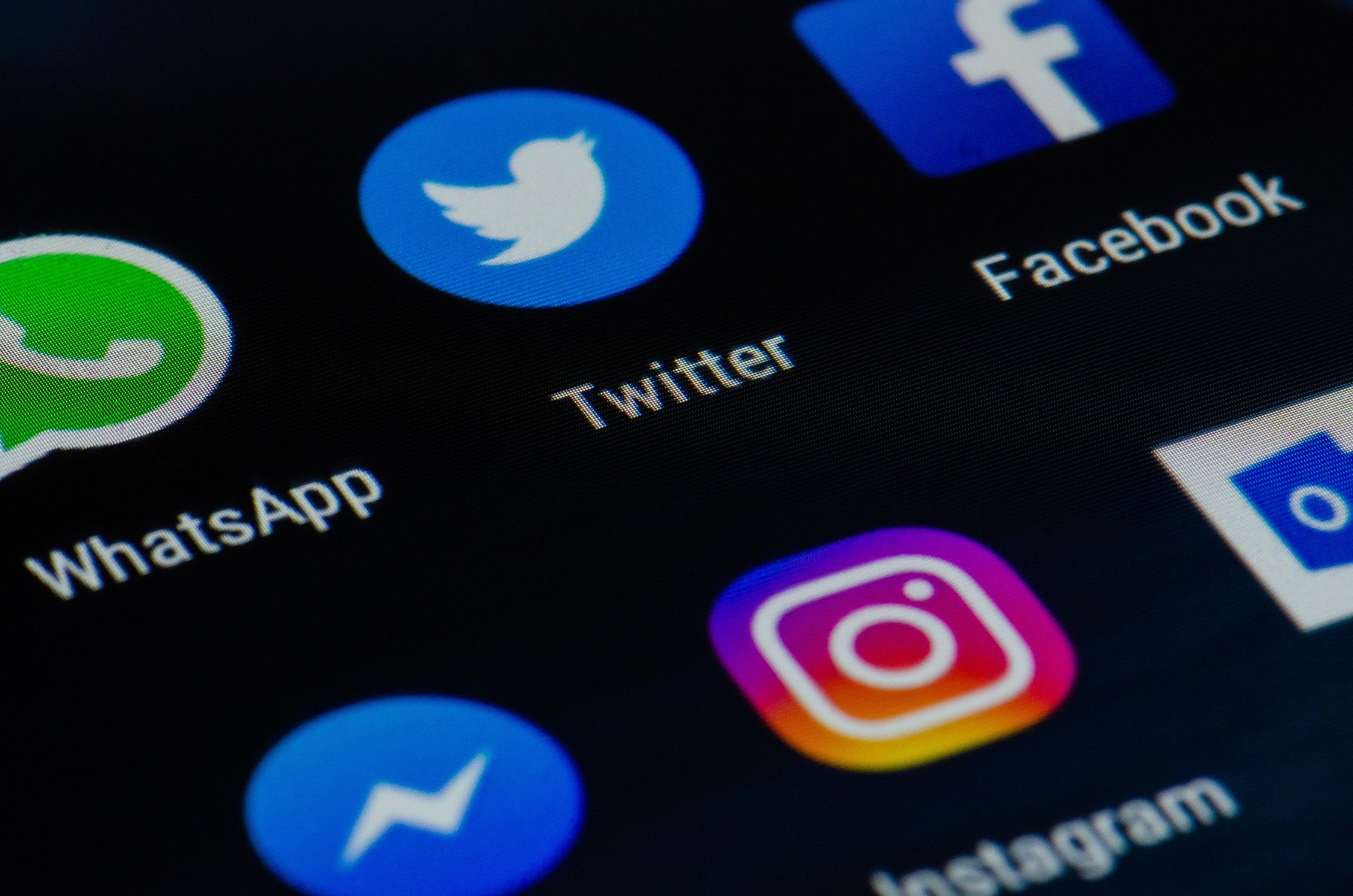 Various app on a screen of a smartphone, Whatsapp, Twitter, Facebook, Messenger, Instagram, Outlook