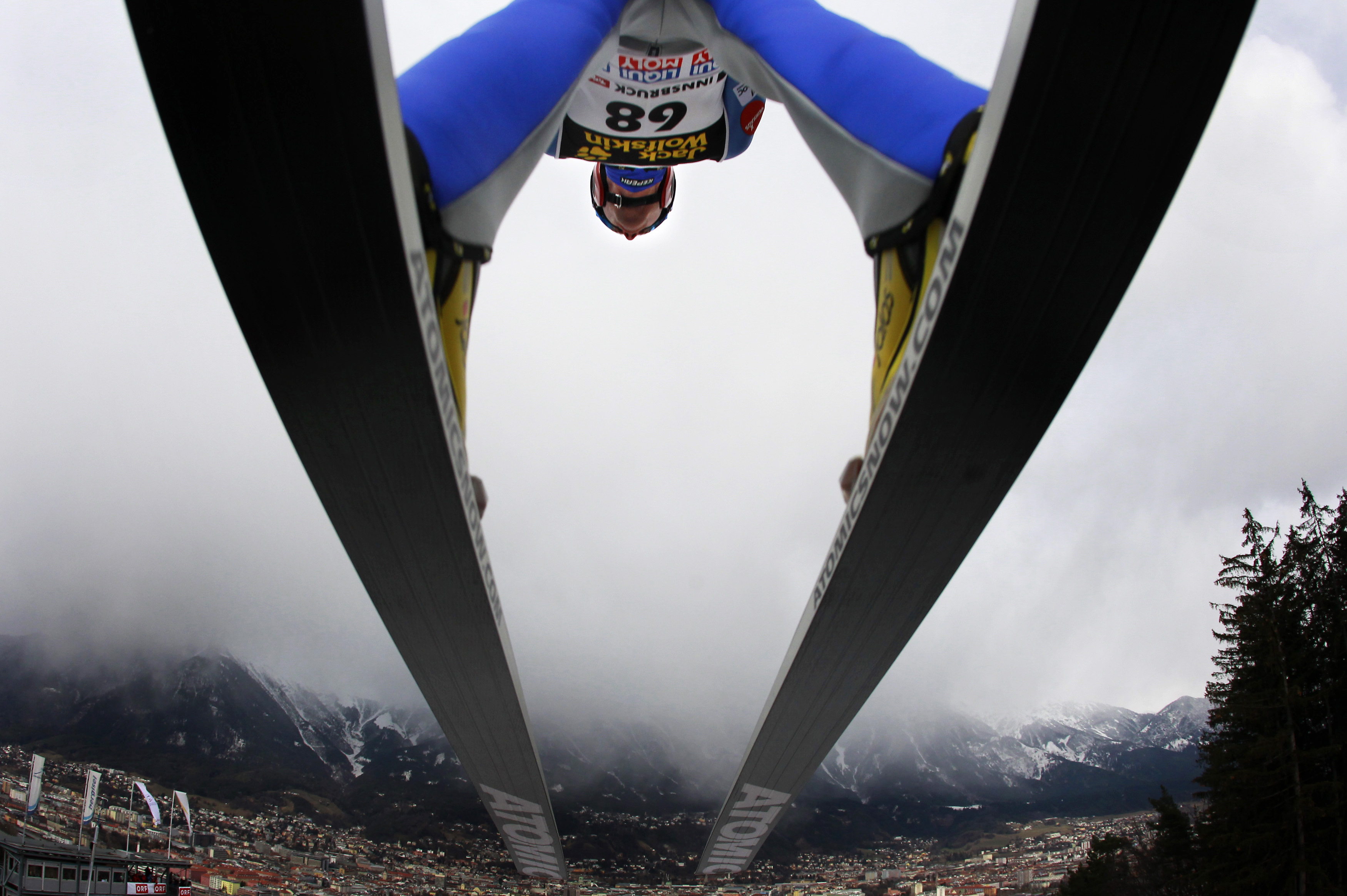 Finland's Janne Ahonen soars through heavy snow clouds during the practice for the third event of the four-hills ski jumping tournament in Innsbruck