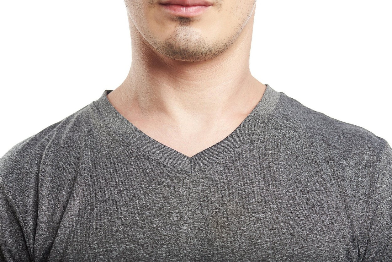 close up of gray v neck t-shirt on mans isolated on white