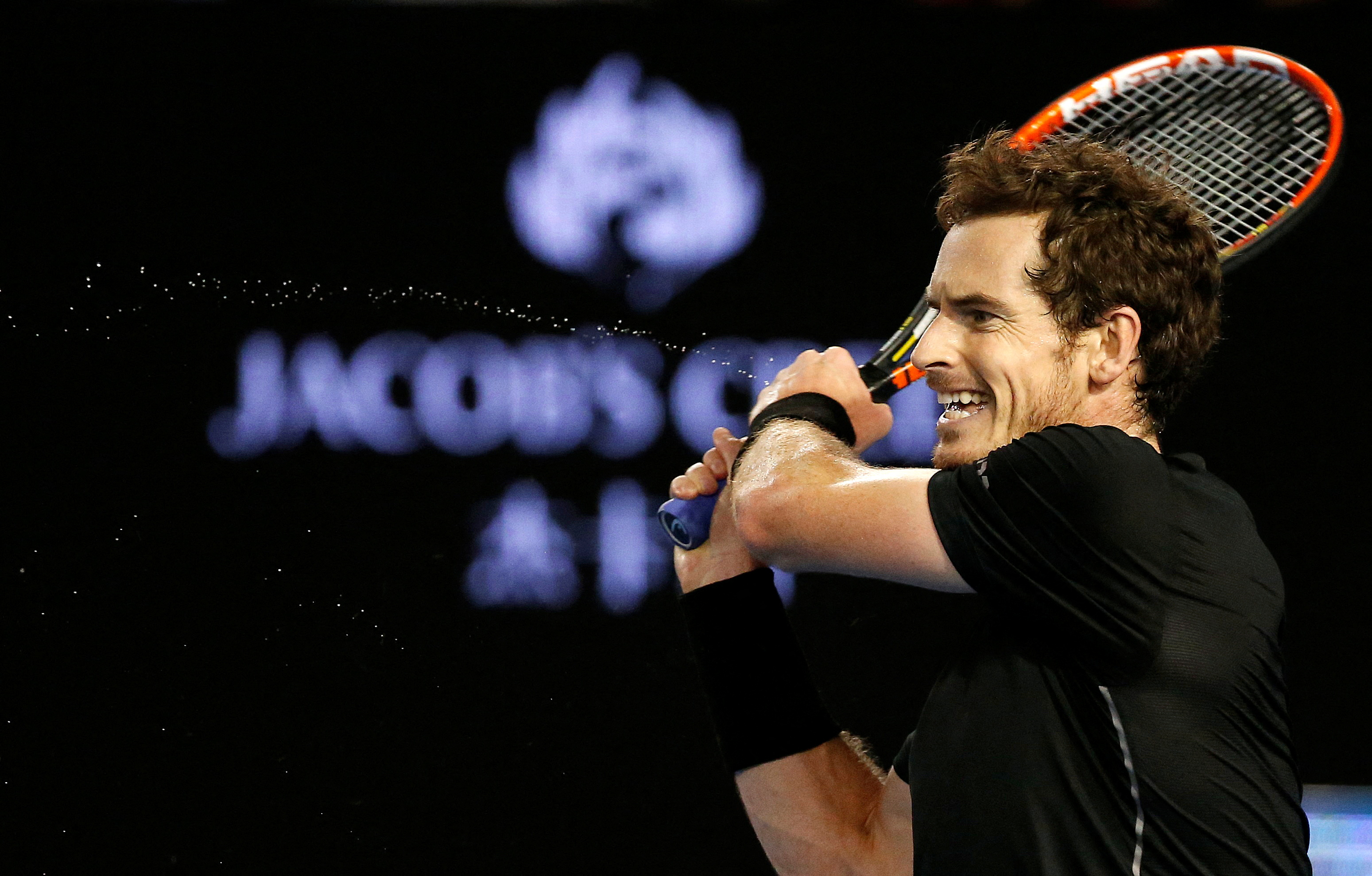 FILE PHOTO: Britain's Andy Murray hits a shot during his final match against Serbia's Novak Djokovic at the Australian Open tennis tournament at Melbourne Park