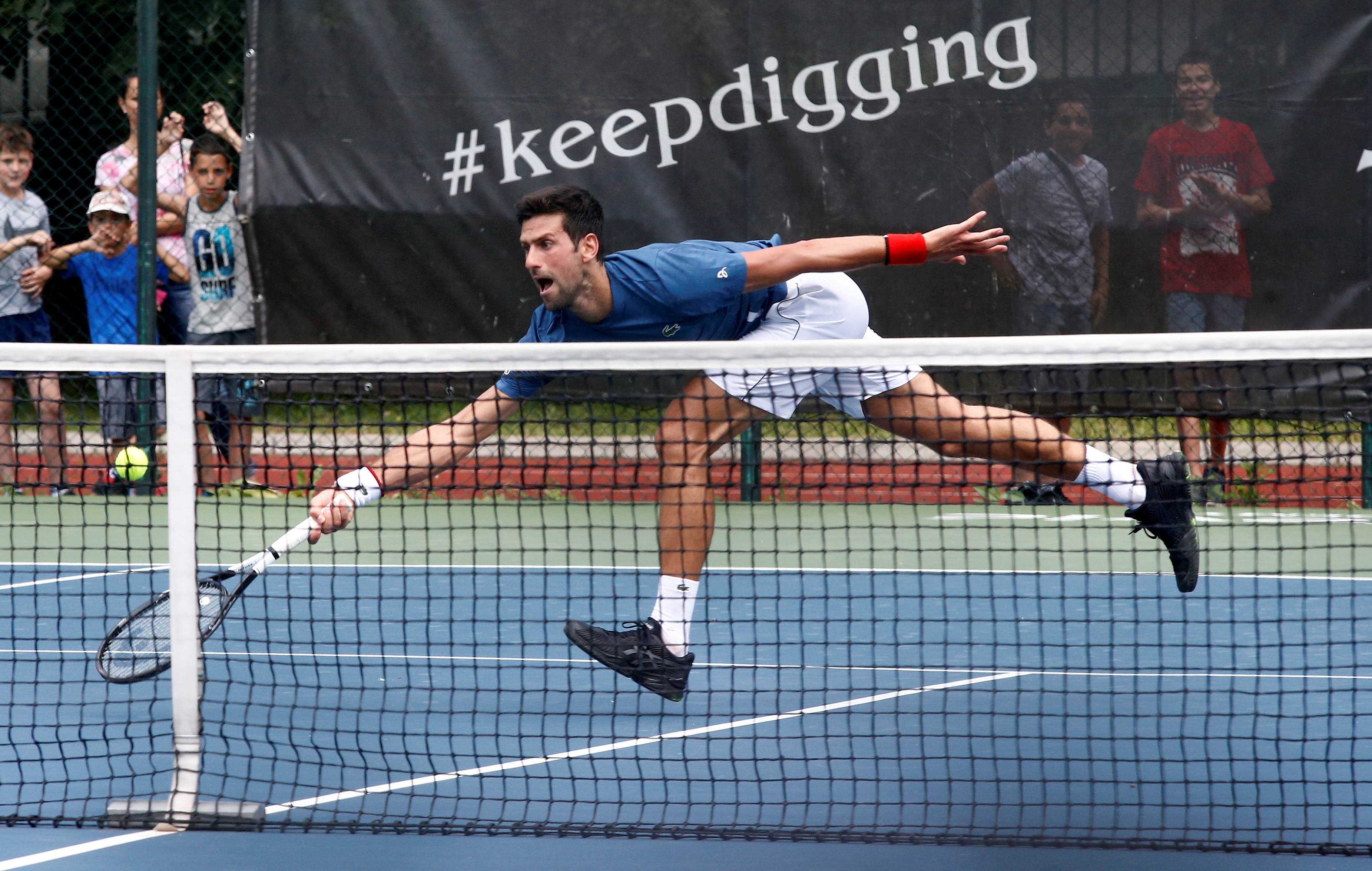 FILE PHOTO: Novak Djokovic of Serbia attends a training session in Belgrade