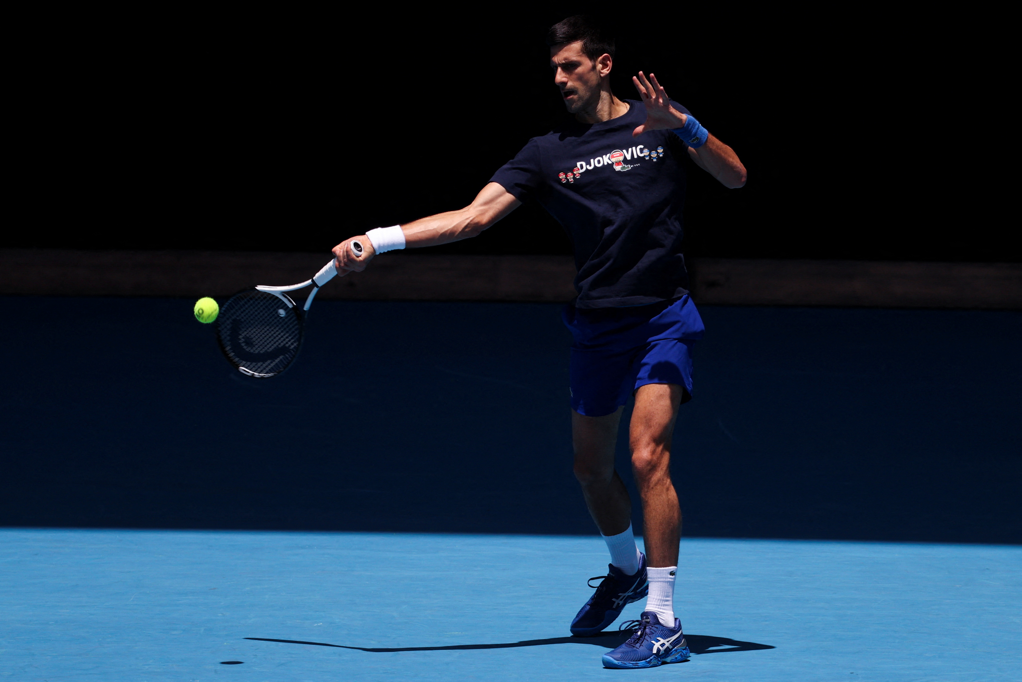 Serbian tennis player Novak Djokovic practices at Melbourne Park as questions remain over the legal battle regarding his visa to play in the Australian Open