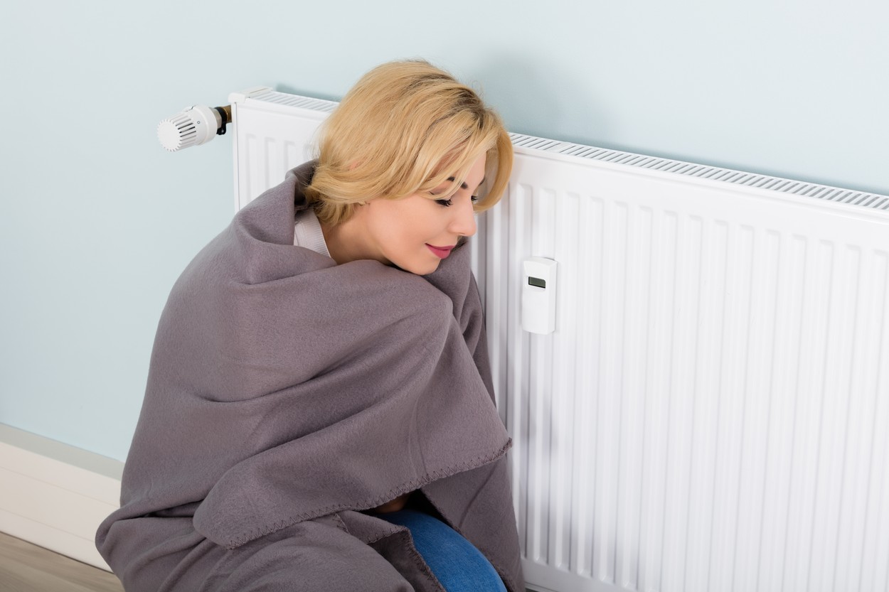 Woman With Blanket Suffering From Cold