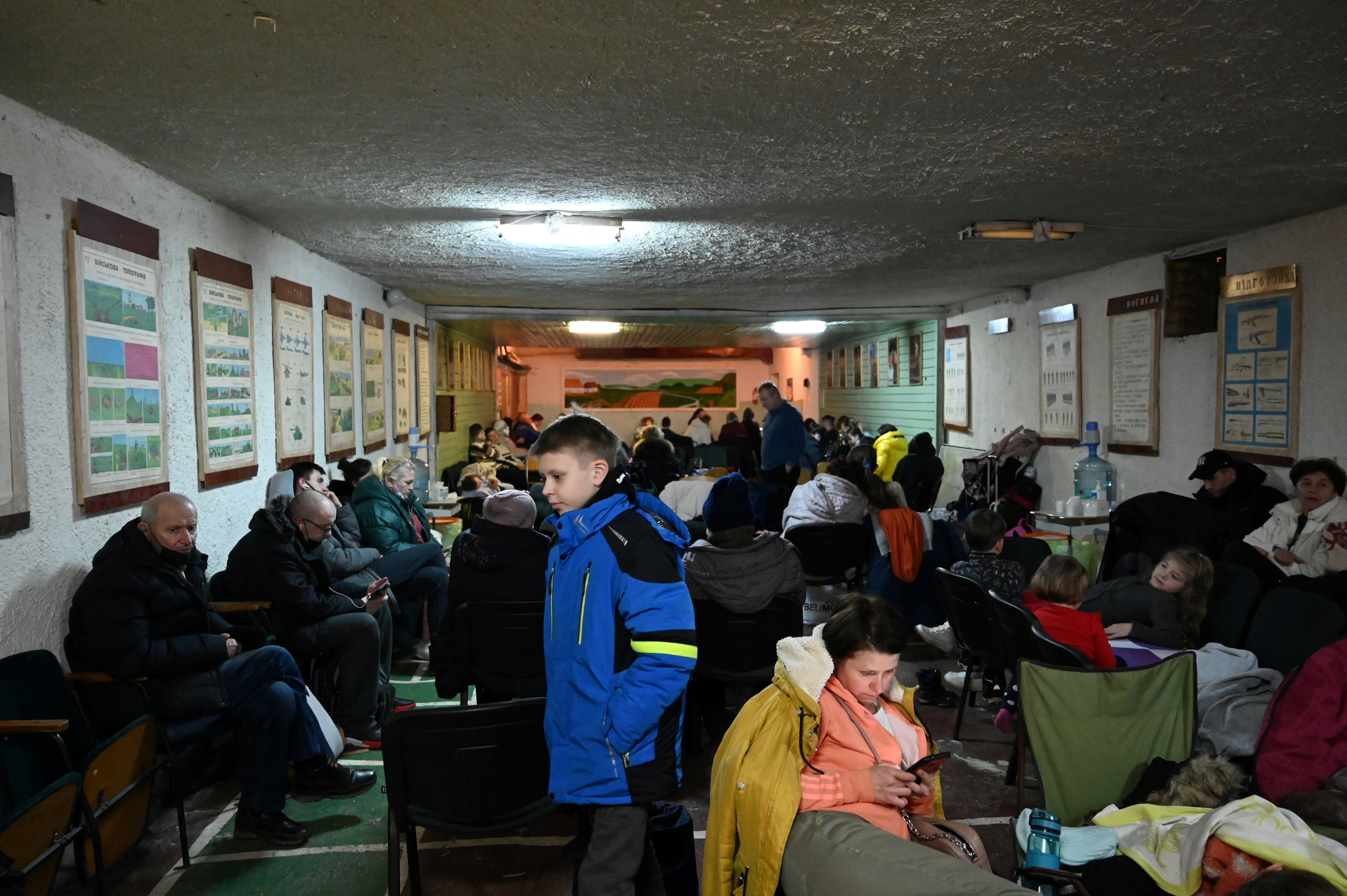 People gather in an air raid shelter in Kyiv