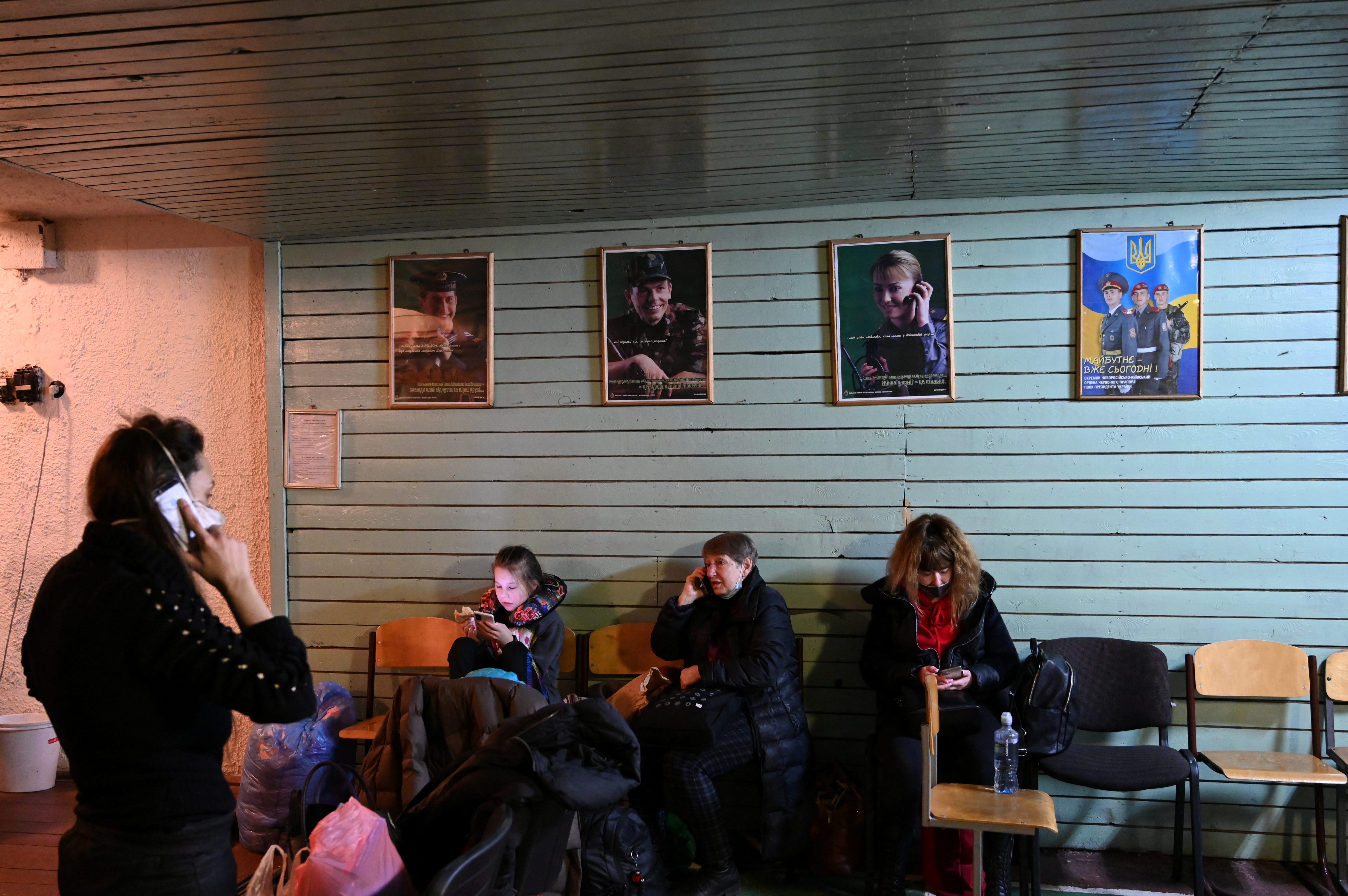 People gather in an air raid shelter in Kyiv