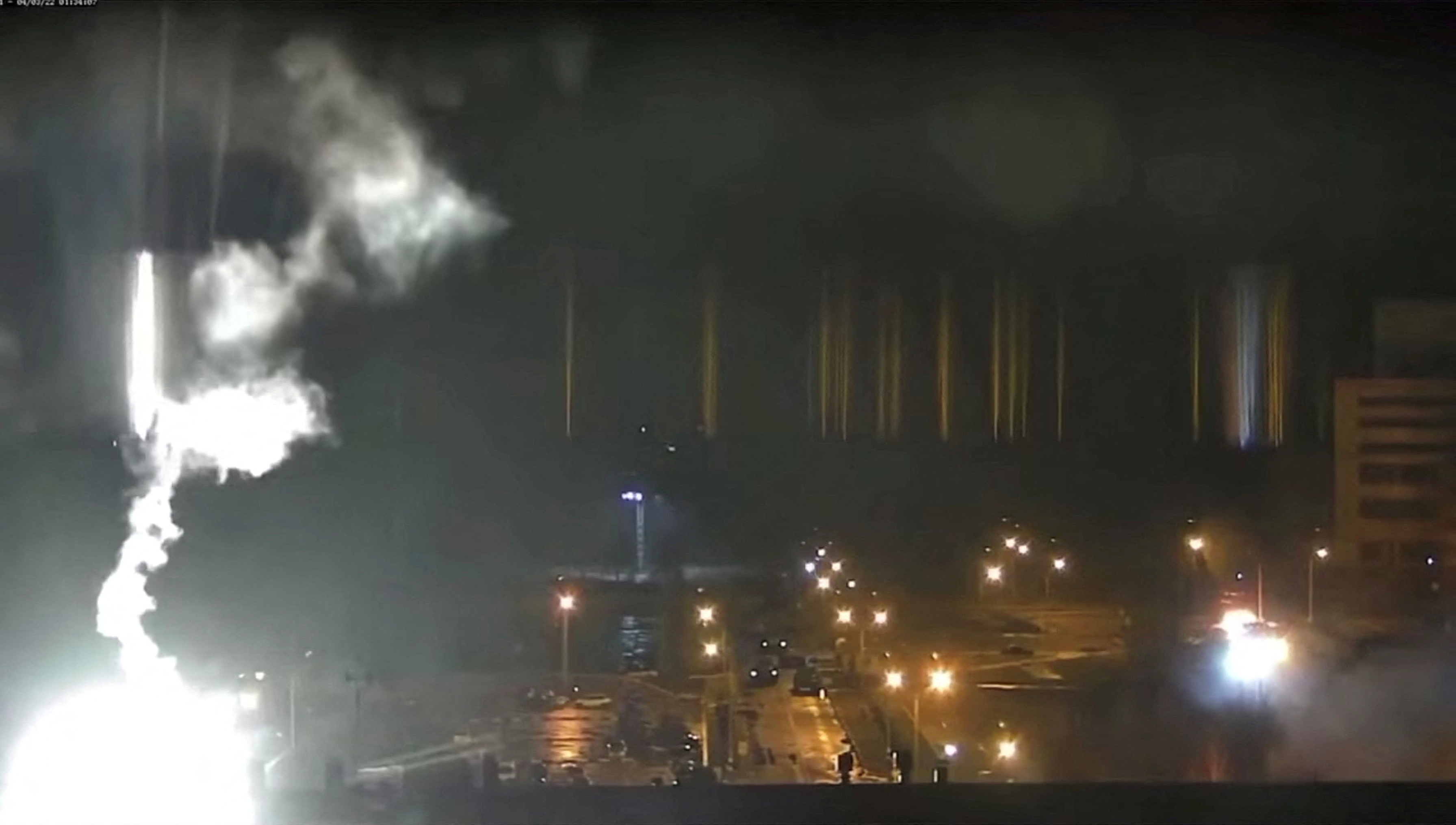 Surveillance camera footage shows a flare landing at the Zaporizhzhia nuclear power plant during shelling in Enerhodar