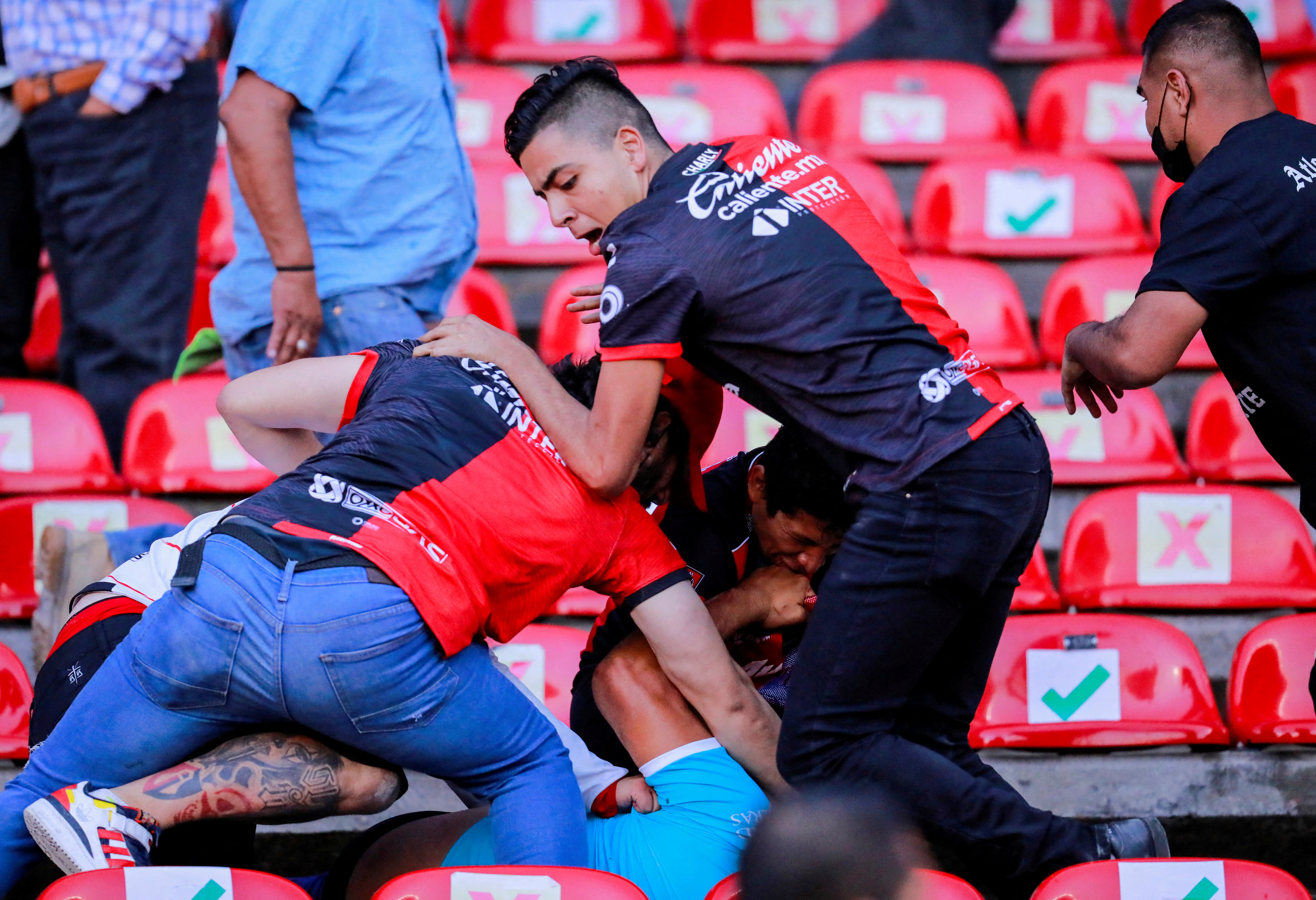 People are beaten at the Corregidora stadium in Queretaro