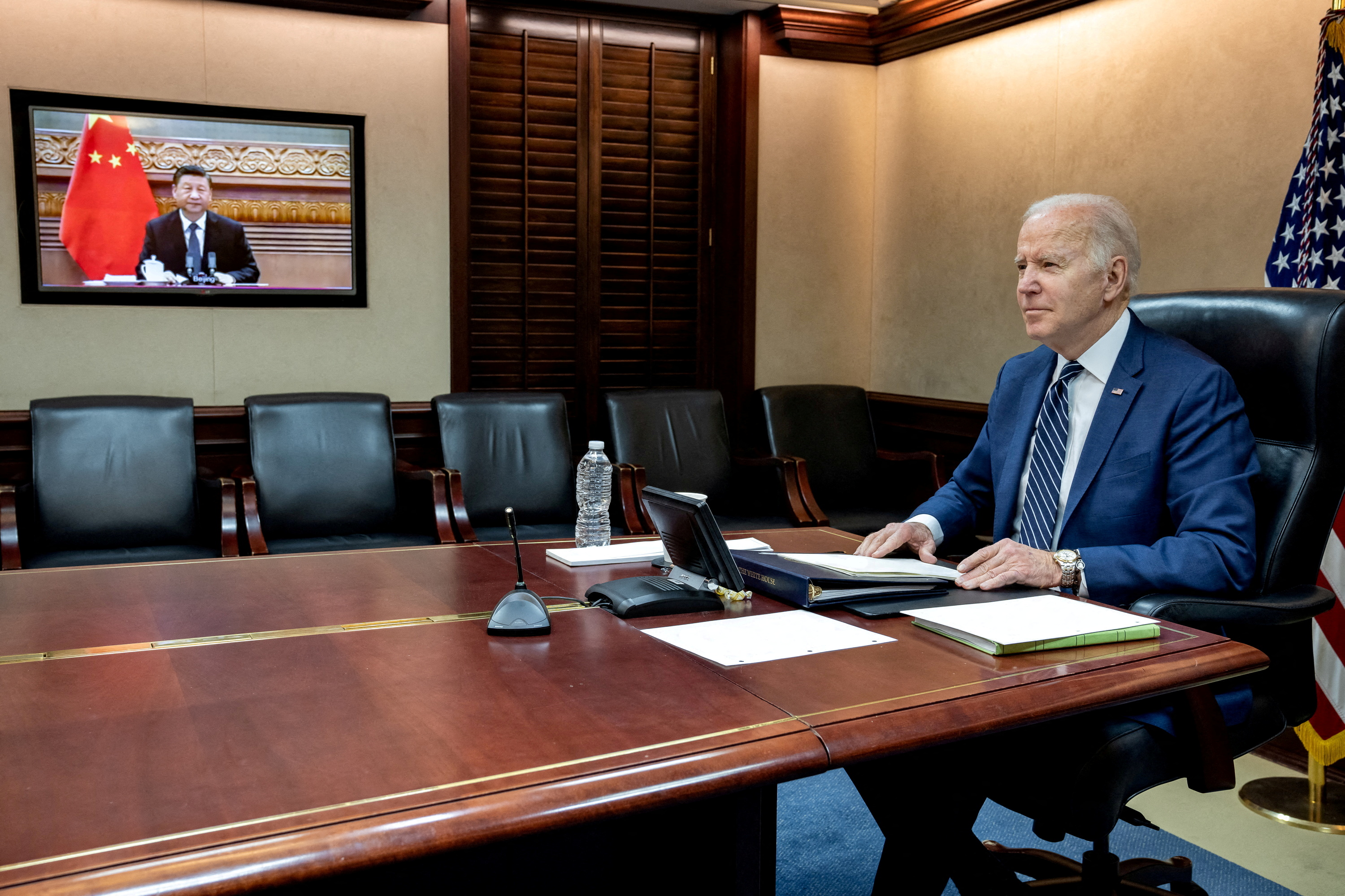 FILE PHOTO: U.S. President Joe Biden speaks by video with Chinese President Xi Jinping from the Situation Room of the White House in Washington
