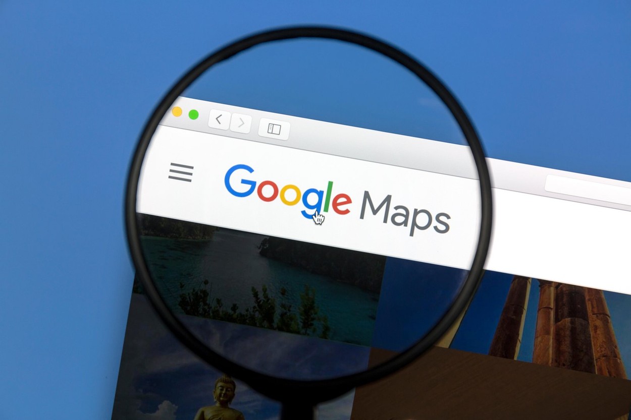 Google Maps website under a magnifying  glass