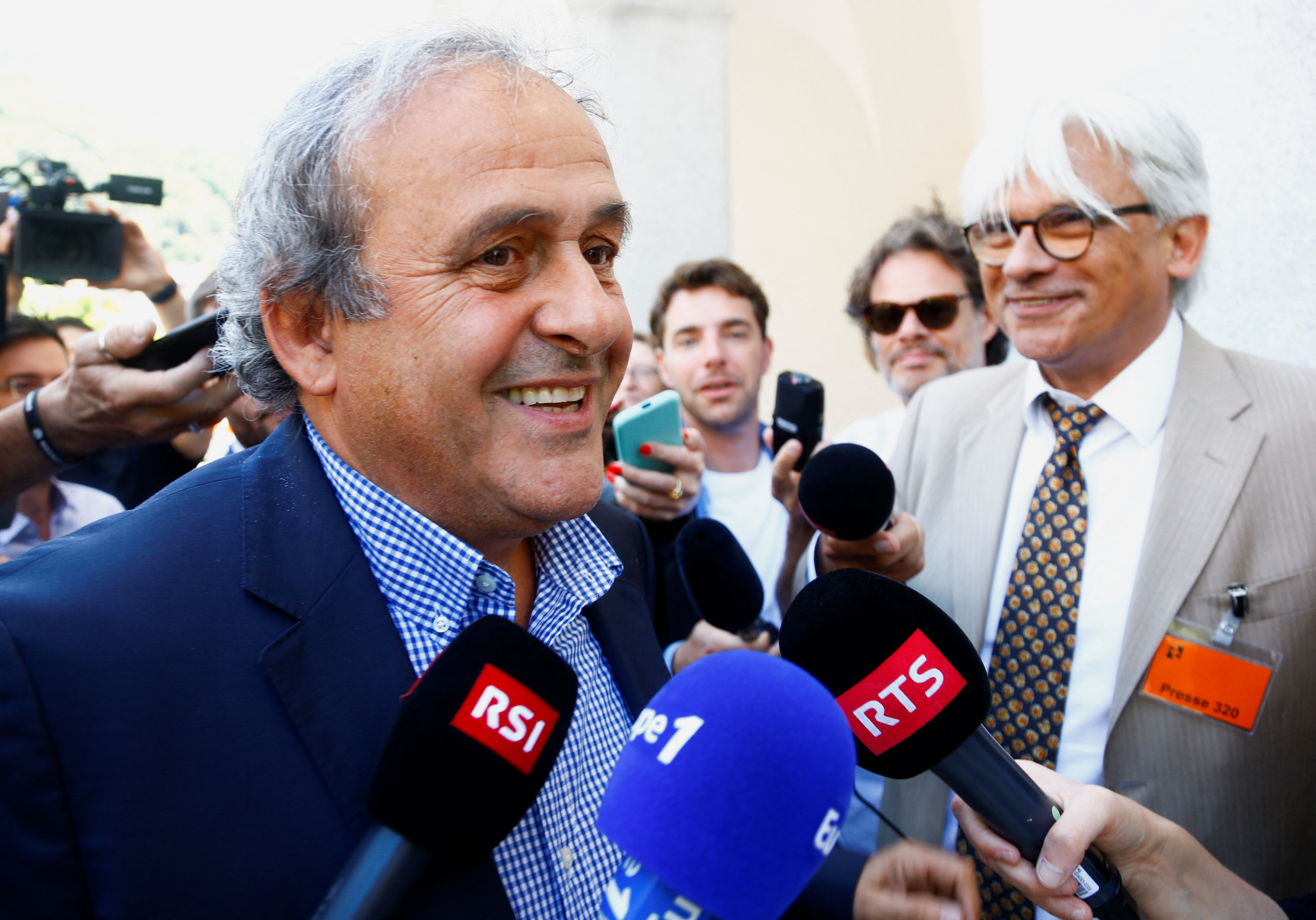 Former soccer officials Sepp Blatter and Michel Platini face corruption charges in Swiss trial
