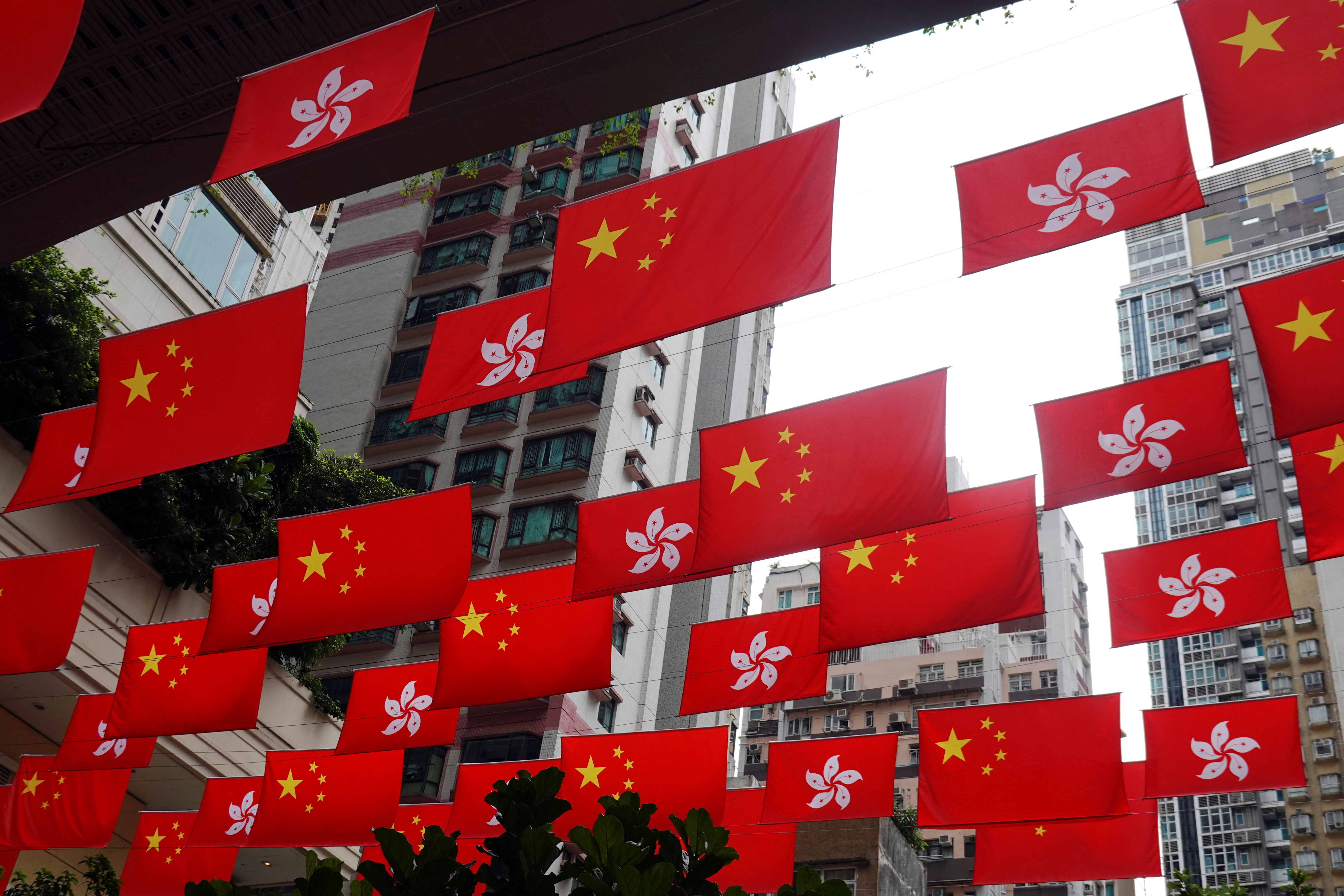 Chinese and Hong Kong flags decorate a street in Hong Kong
