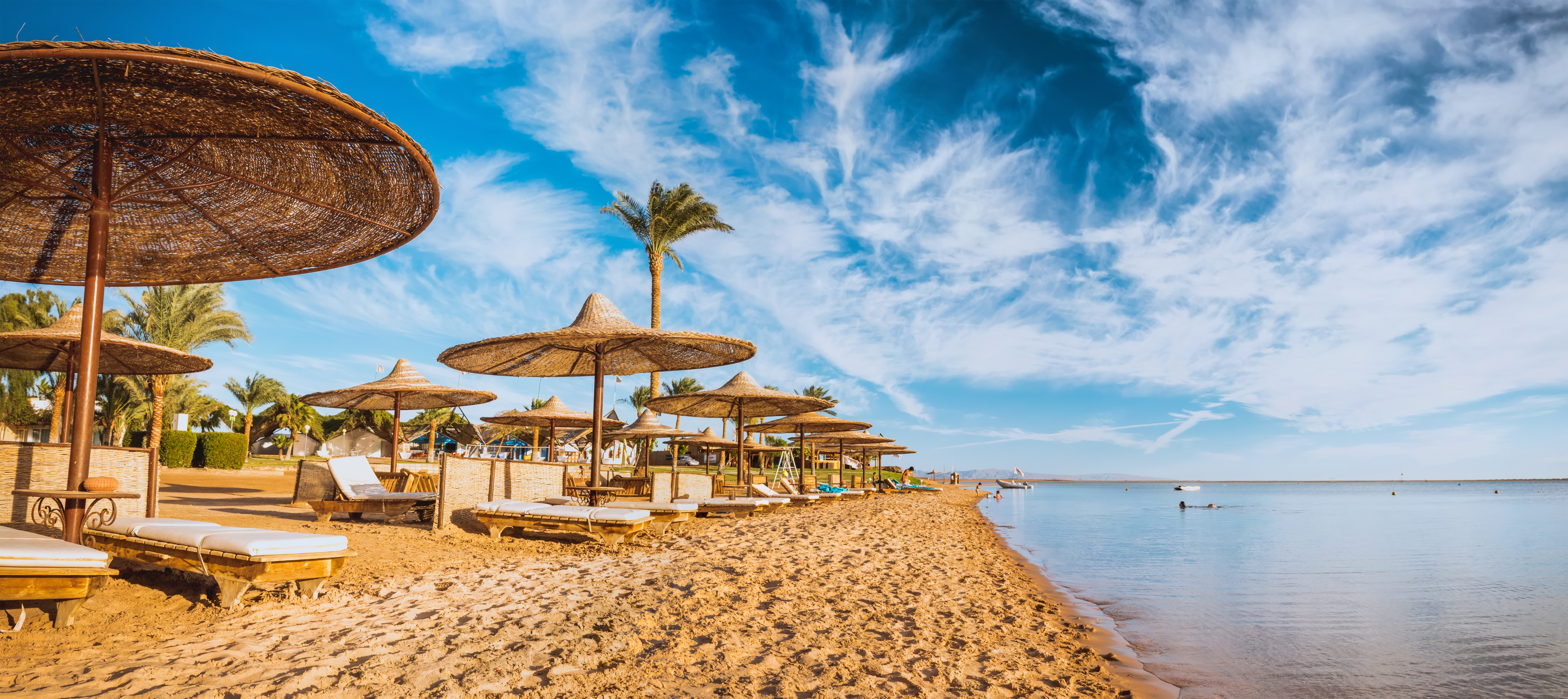 Relax,Under,Parasol,On,The,Beach,Of,Red,Sea,,Egypt
