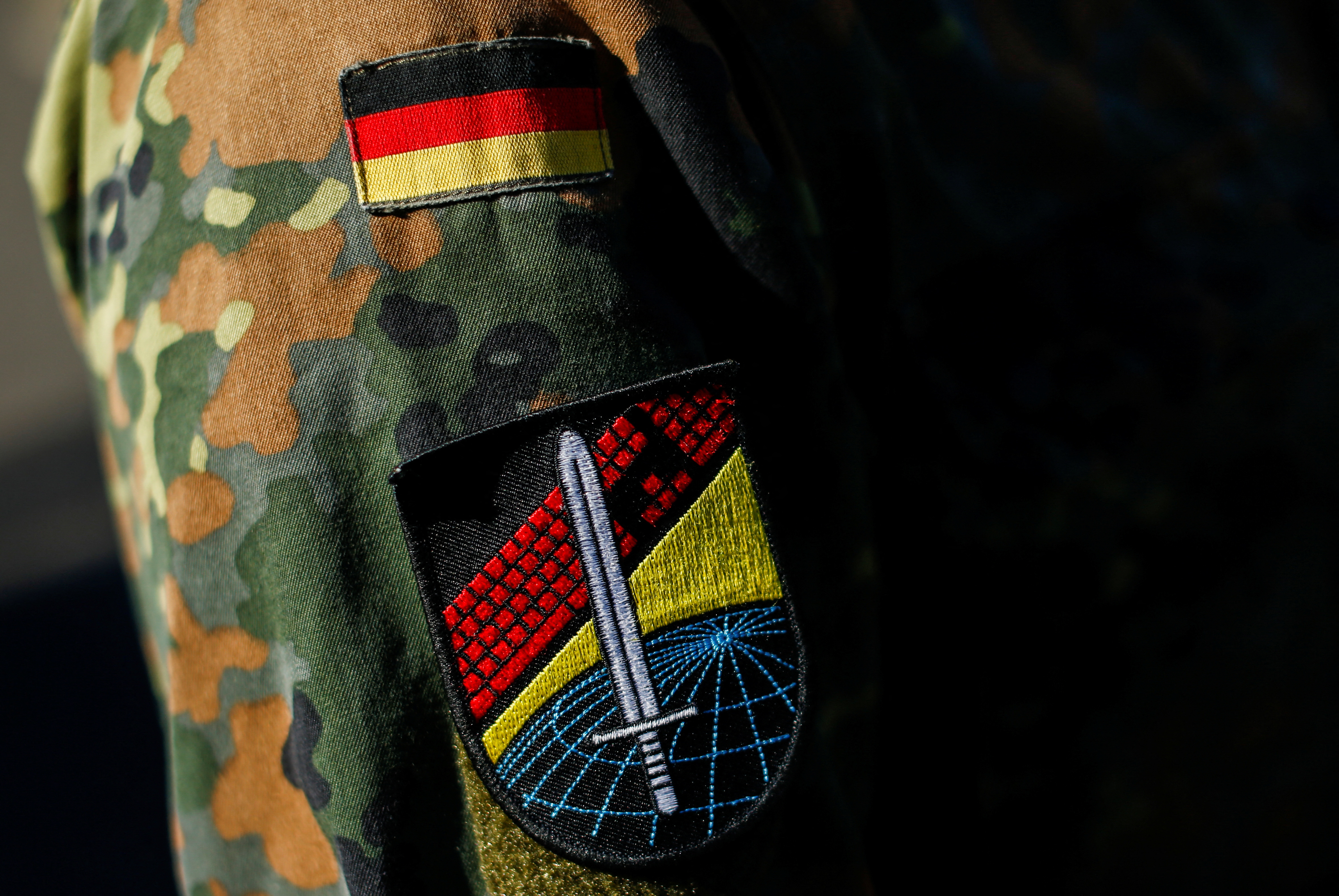 A logo of the Center for Cyber Operations is seen on a jacket of a soldier at the site of German army Bundeswehr, in Rheinbach