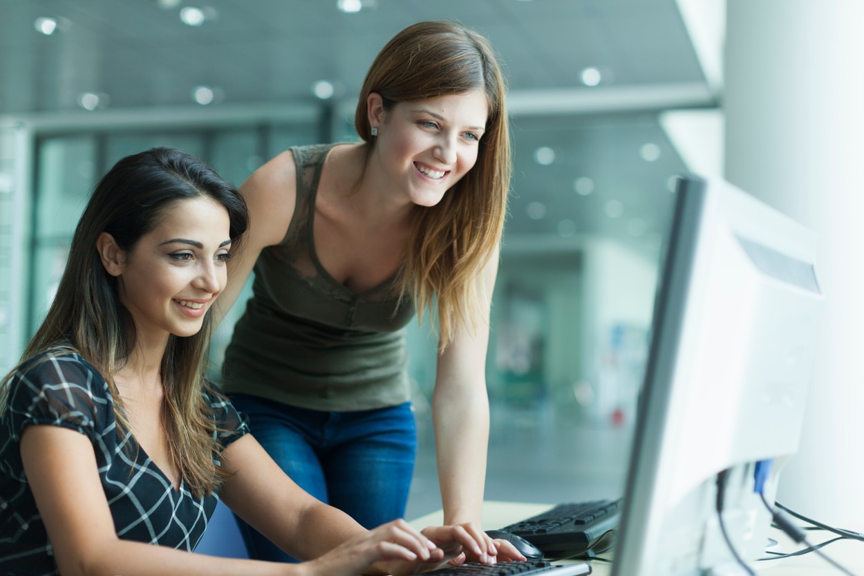 Women using computer in the library