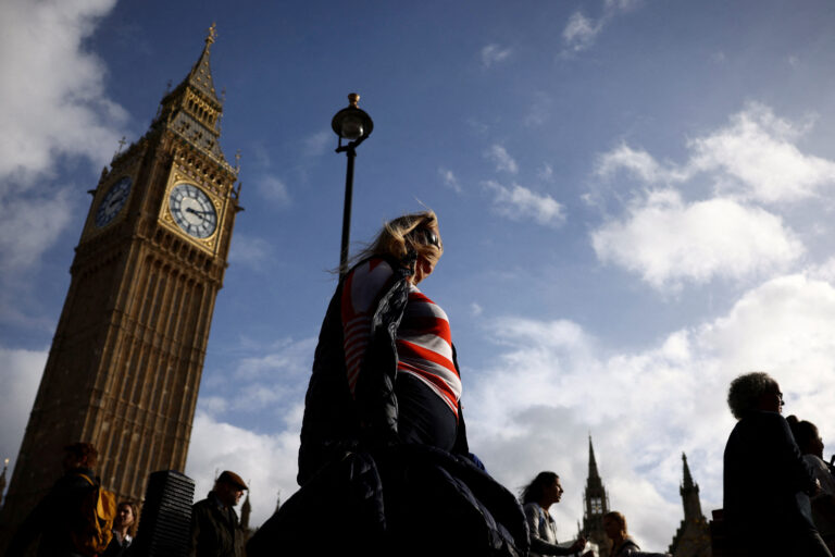FILE PHOTO: People walk in front of the Elizabeth Tower, more commonly known as Big Ben in London