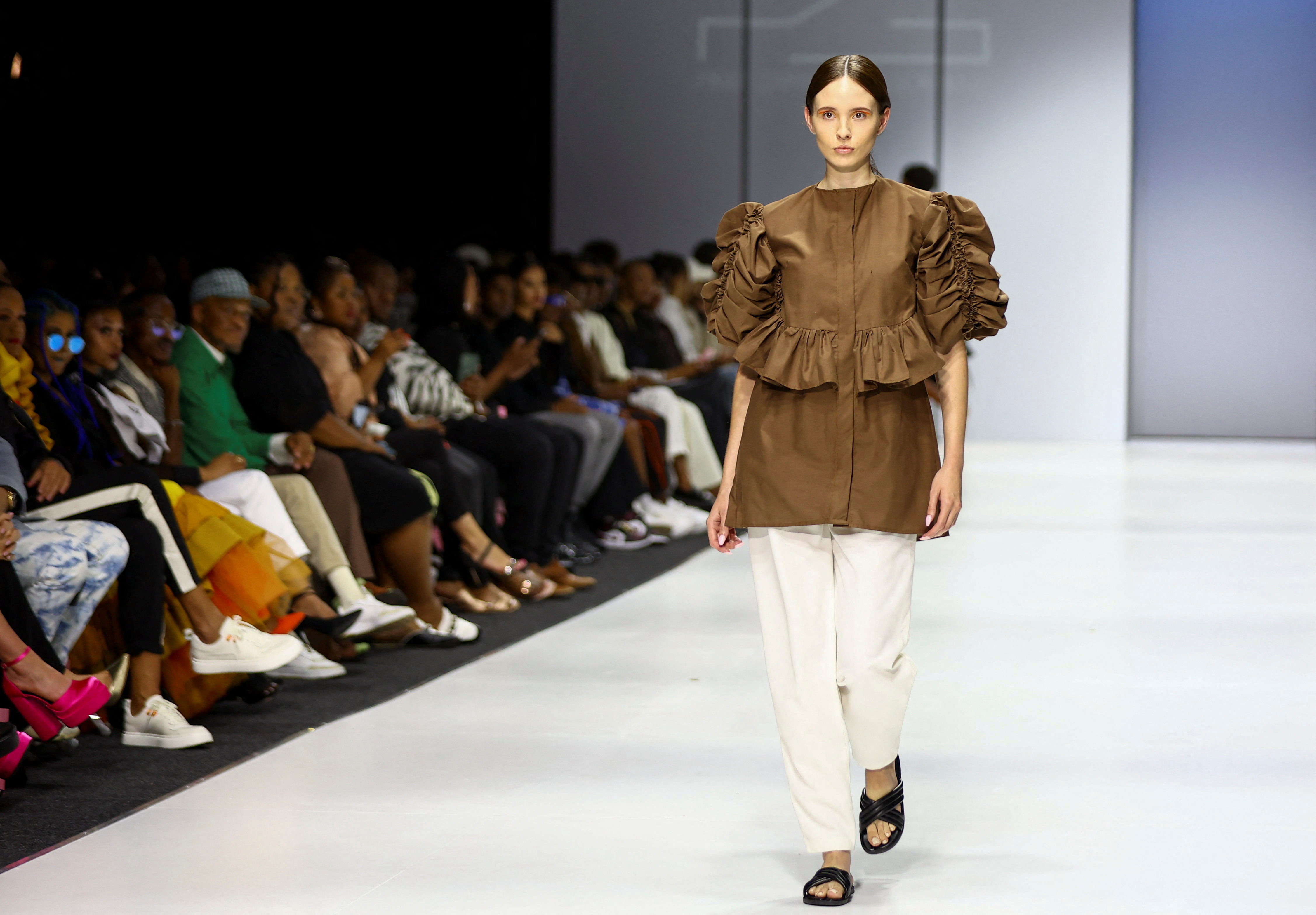 Models present creations at the SA Fashion Week