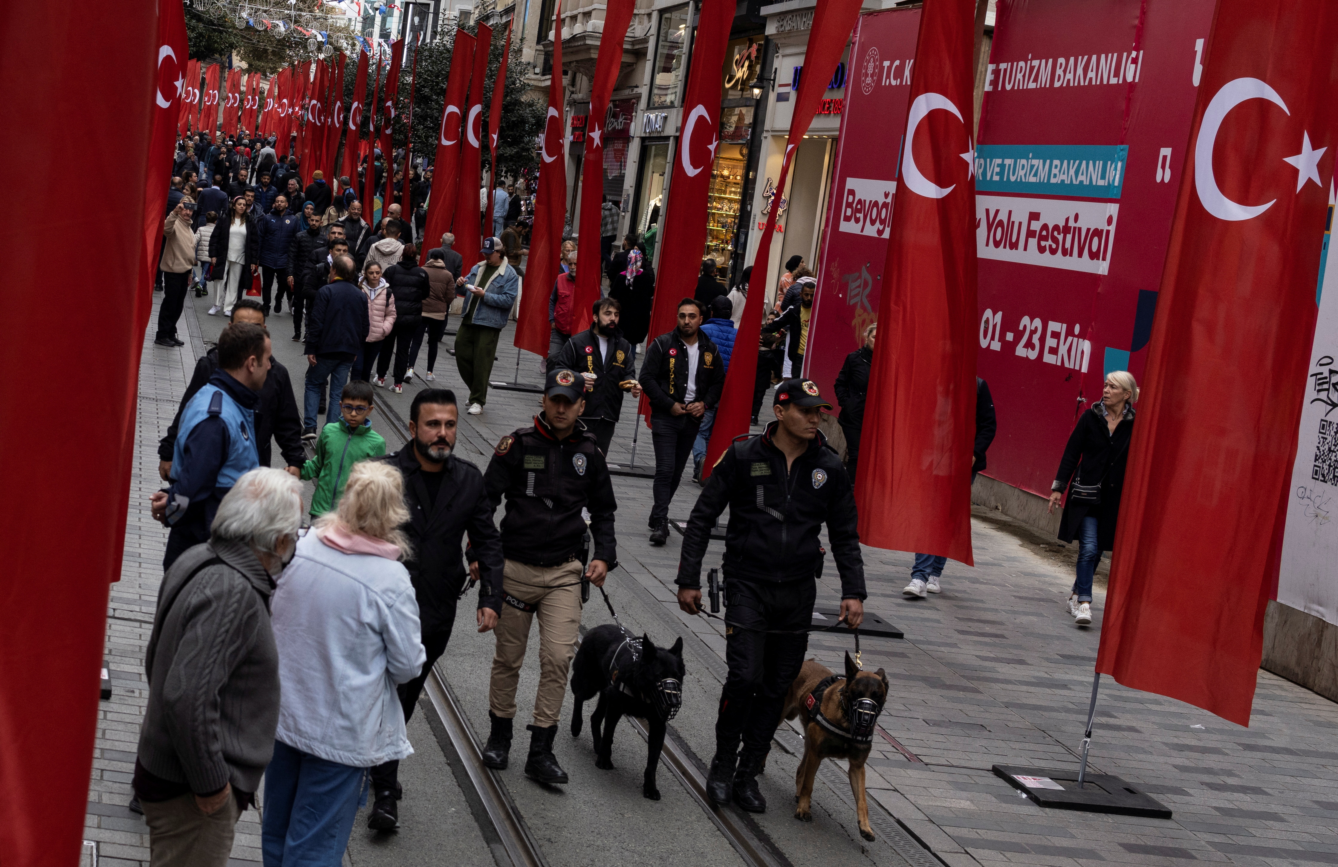 People walk along Istiklal Avenue in Istanbul