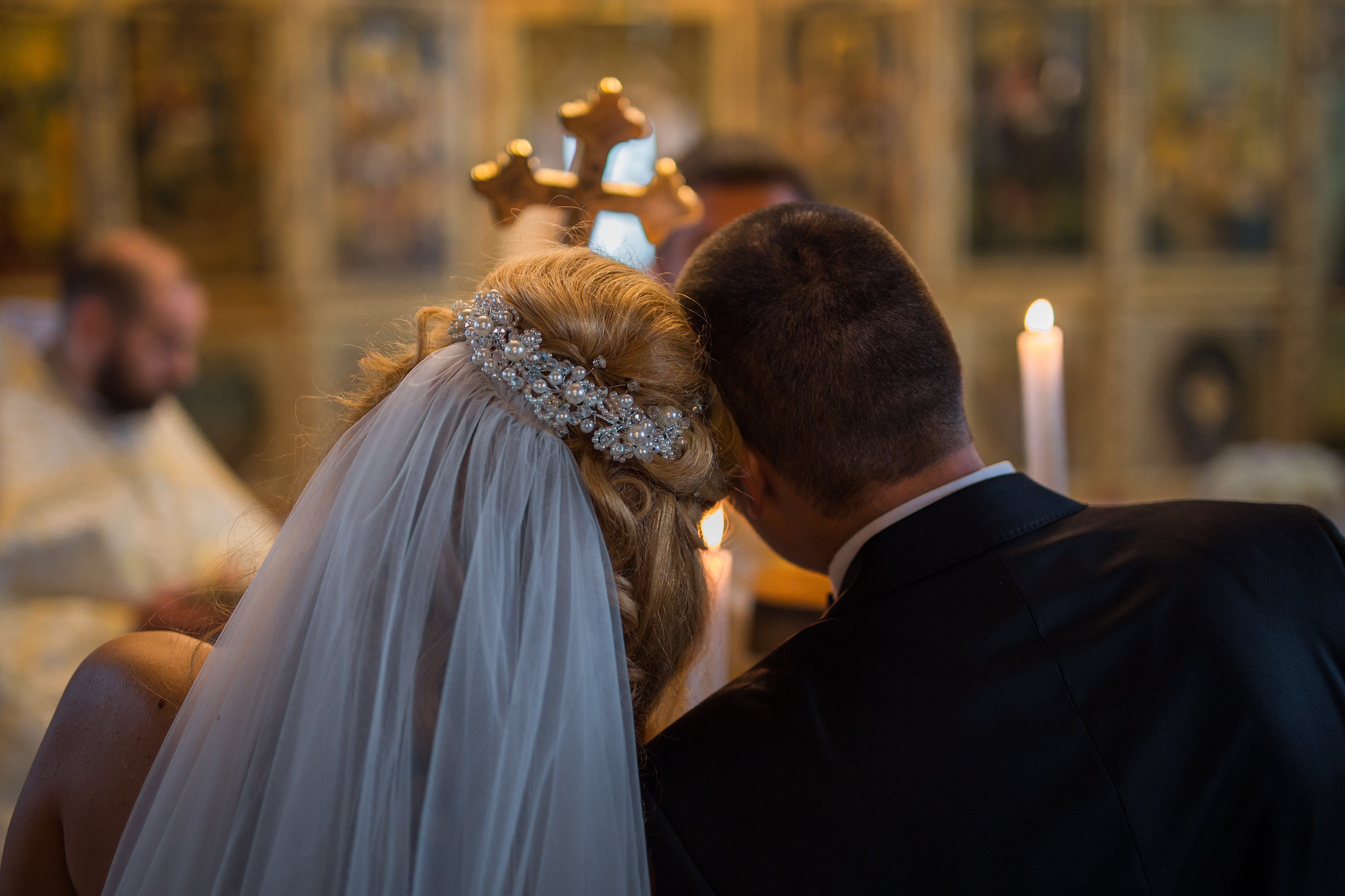 Happy,Stylish,Newlyweds,In,The,Ortodox,Church,At,Wedding