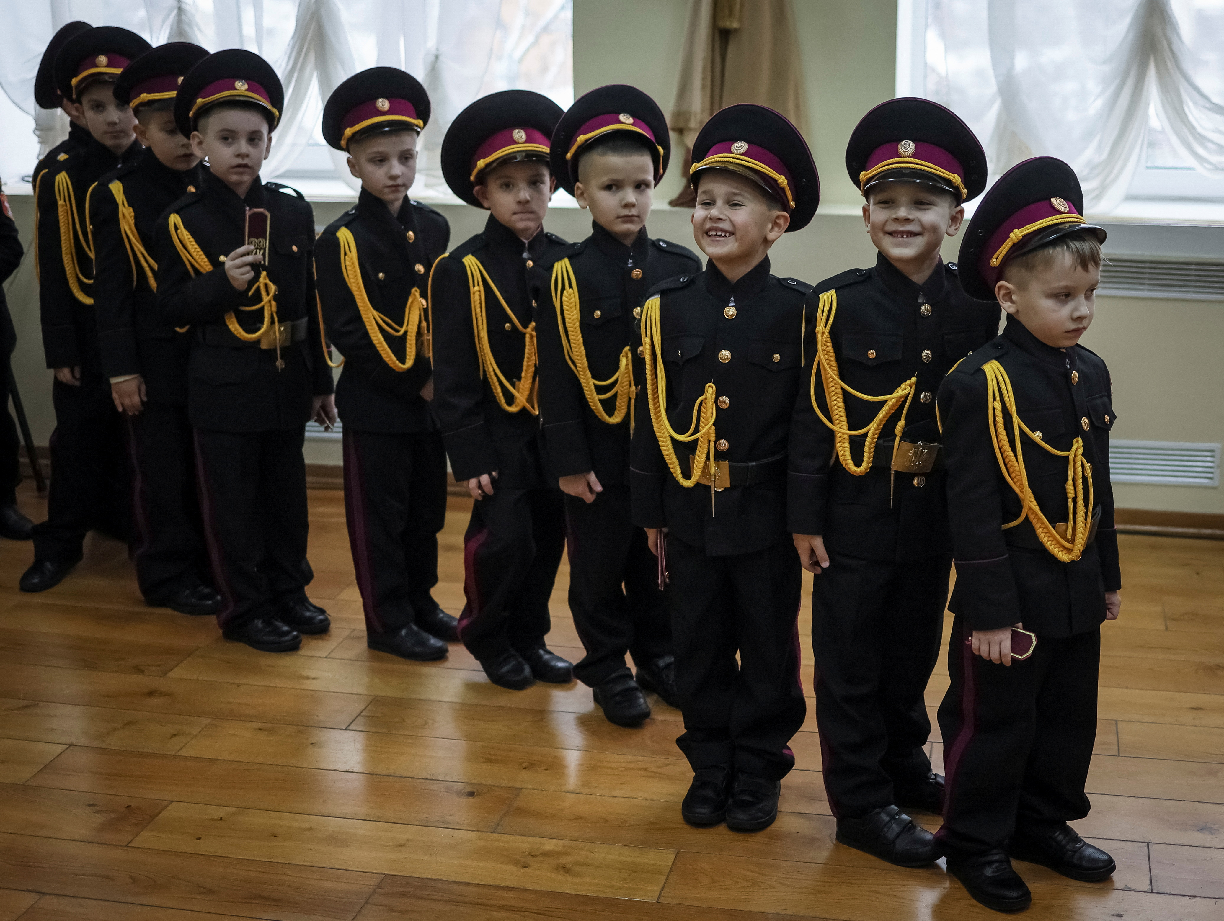 Young military cadets attend a ceremony of receiving shoulder marks in Kyiv