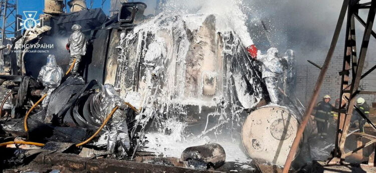 FILE PHOTO: Firefighters work to put out a fire in a thermal power plant, damaged by a Russian missile strike in Zhytomyr