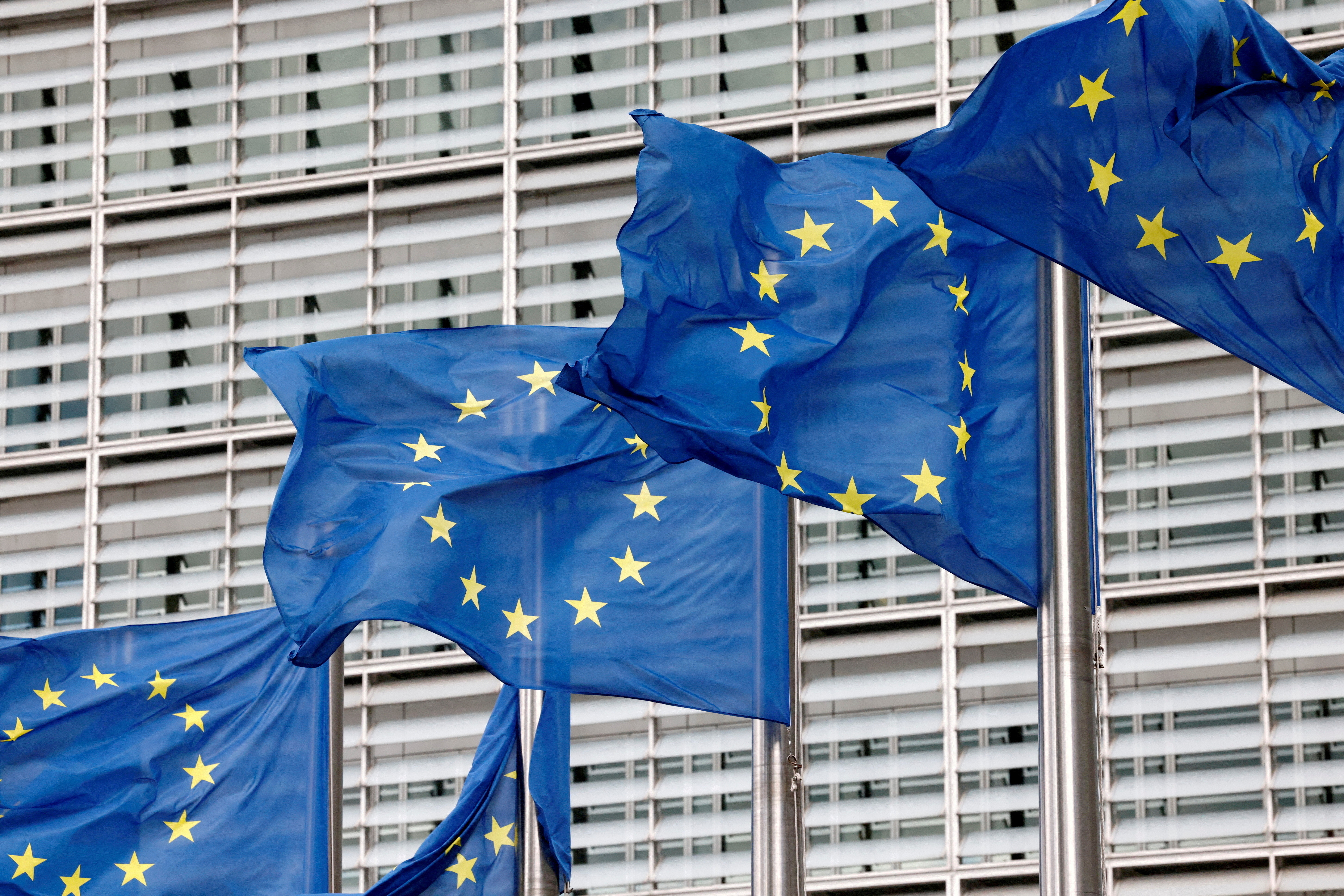 FILE PHOTO: European Union flags flutter outside the EU Commission headquarters in Brussels, Belgium