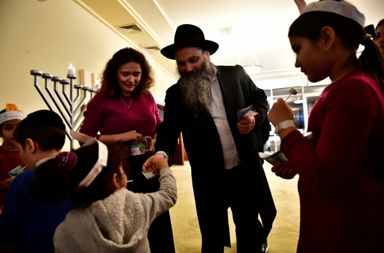 Hasidic Jewish refugees from Ukraine celebrate Hanukkah at a kosher shelter on the banks of Hungary's Lake Balaton