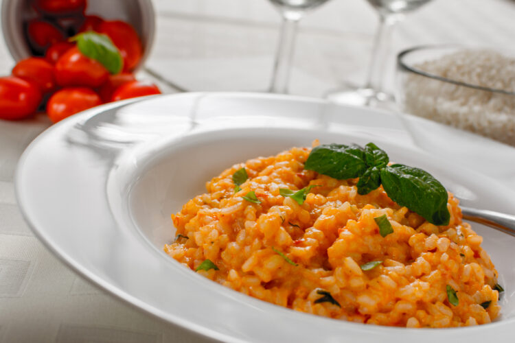 Red,Risotto,With,Tomato,And,Basil,On,White,Plate