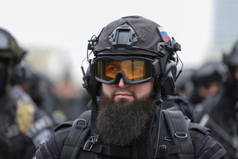Service members gather in a square during head of the Chechen Republic Ramzan Kadyrov's address in Grozny