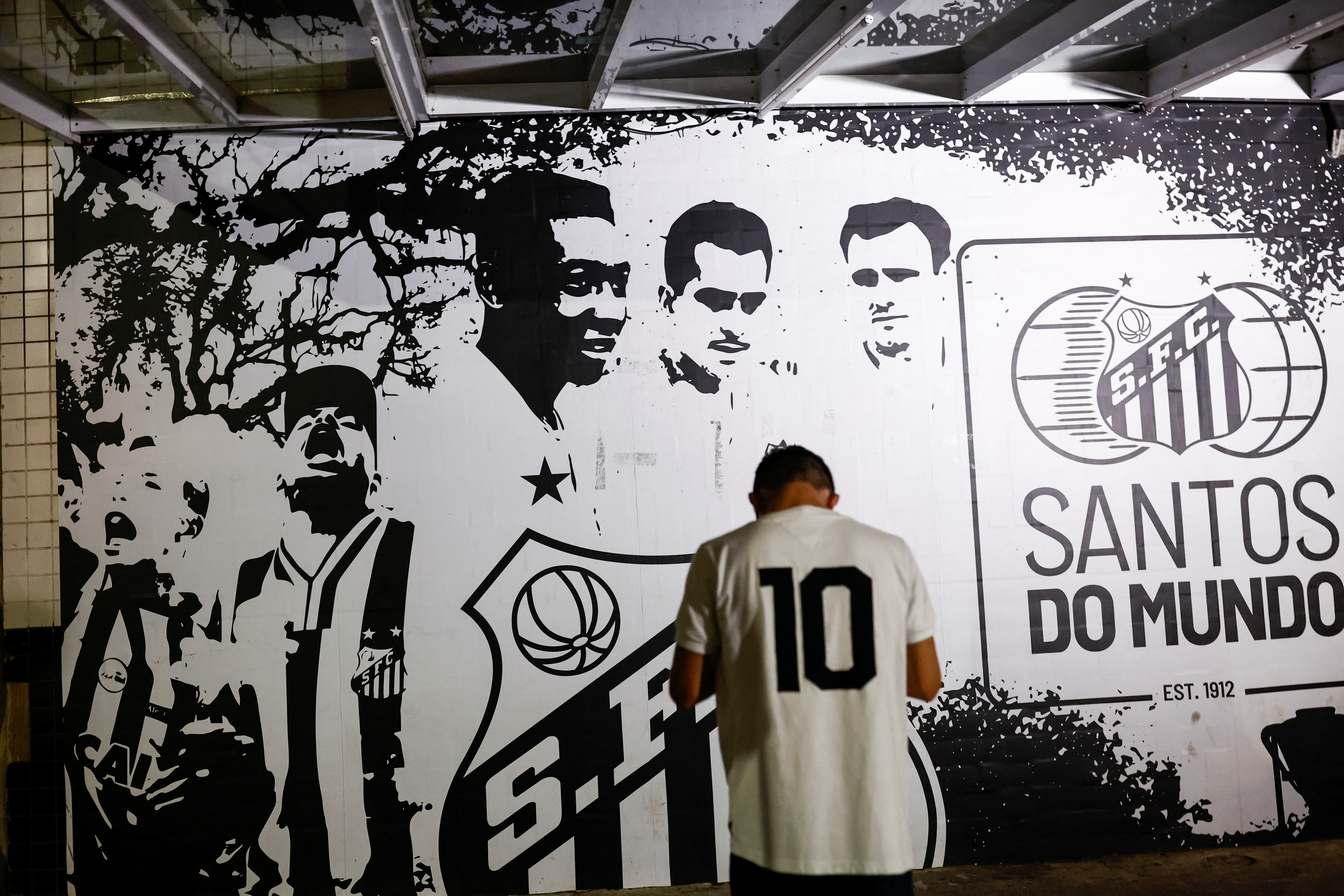 People mourn the death of Brazilian soccer legend Pele, in Santos