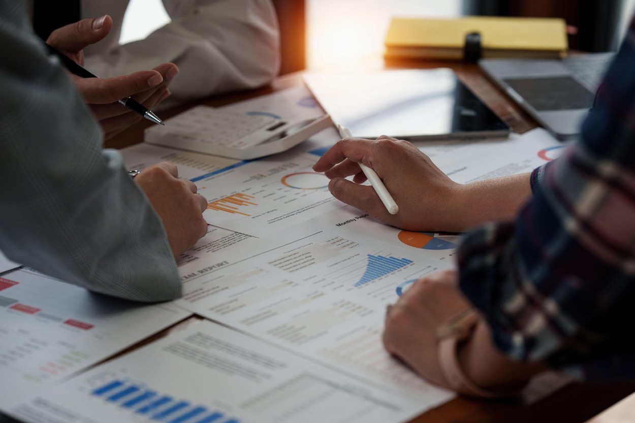 Group of Business planning business strategy and brainstorming to analyze direction global economy. Finance concept.