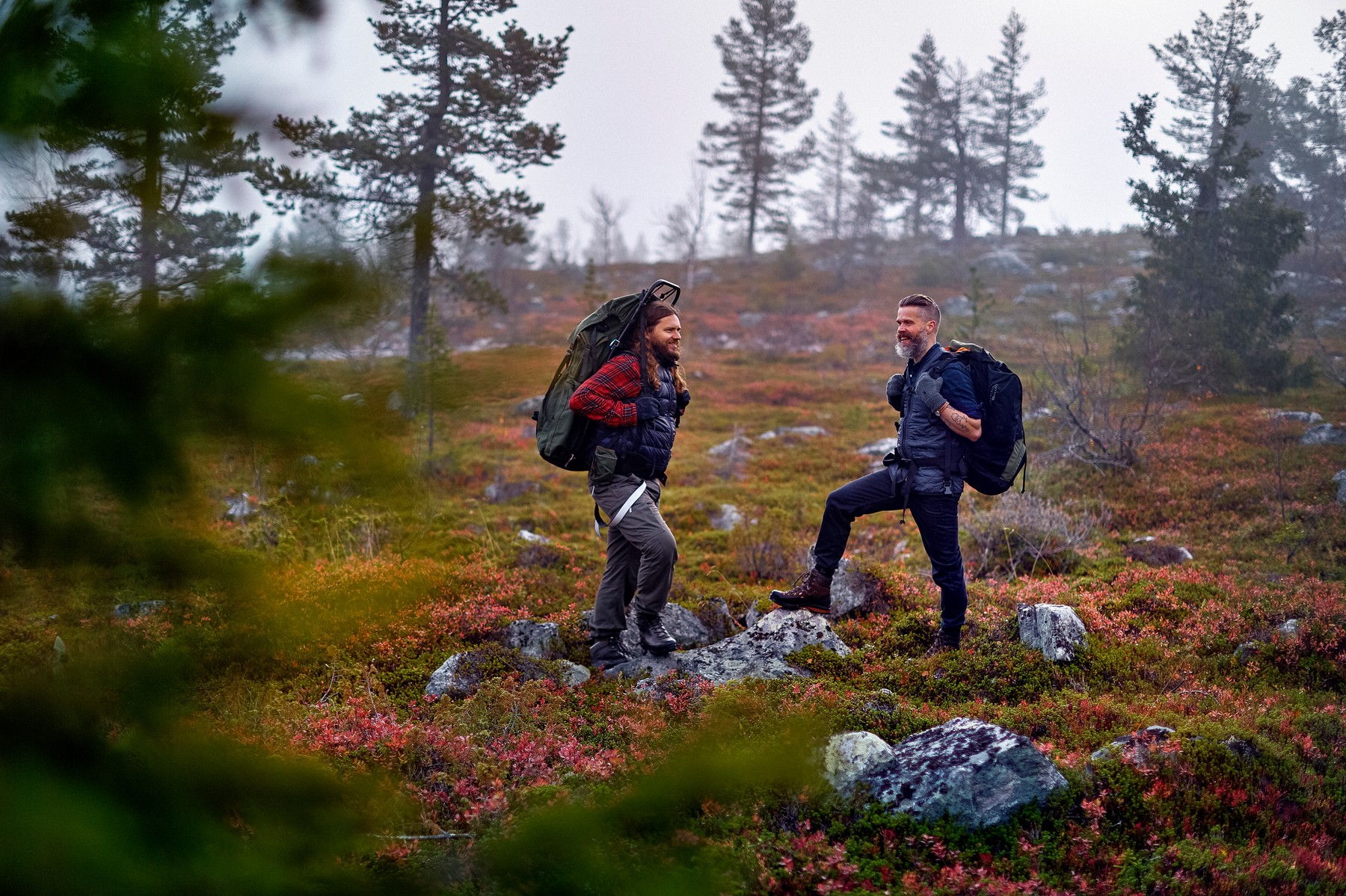 Hikers waiting in park, Sarkitunturi, Lapland, Finland