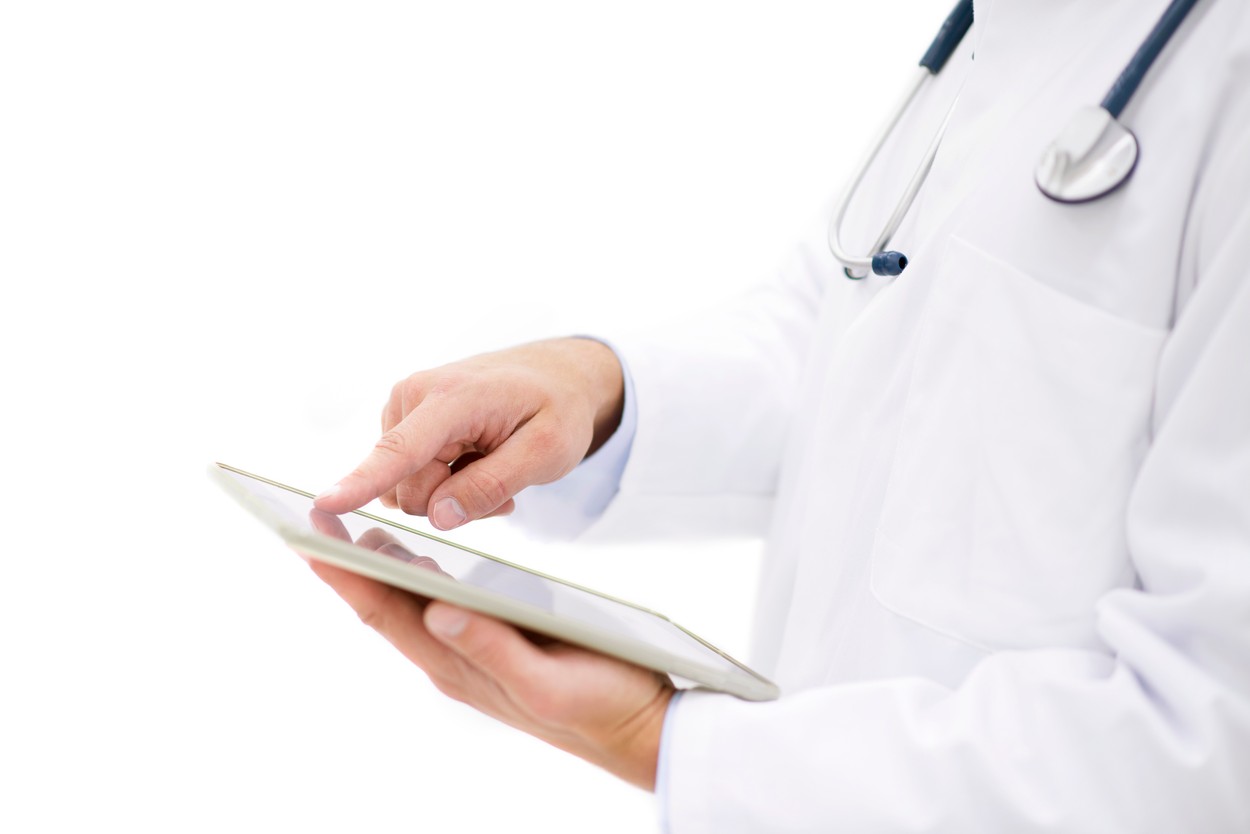 Doctor using digital tablet