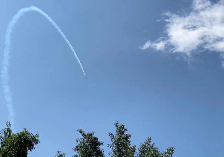 A plane flies over Romulus