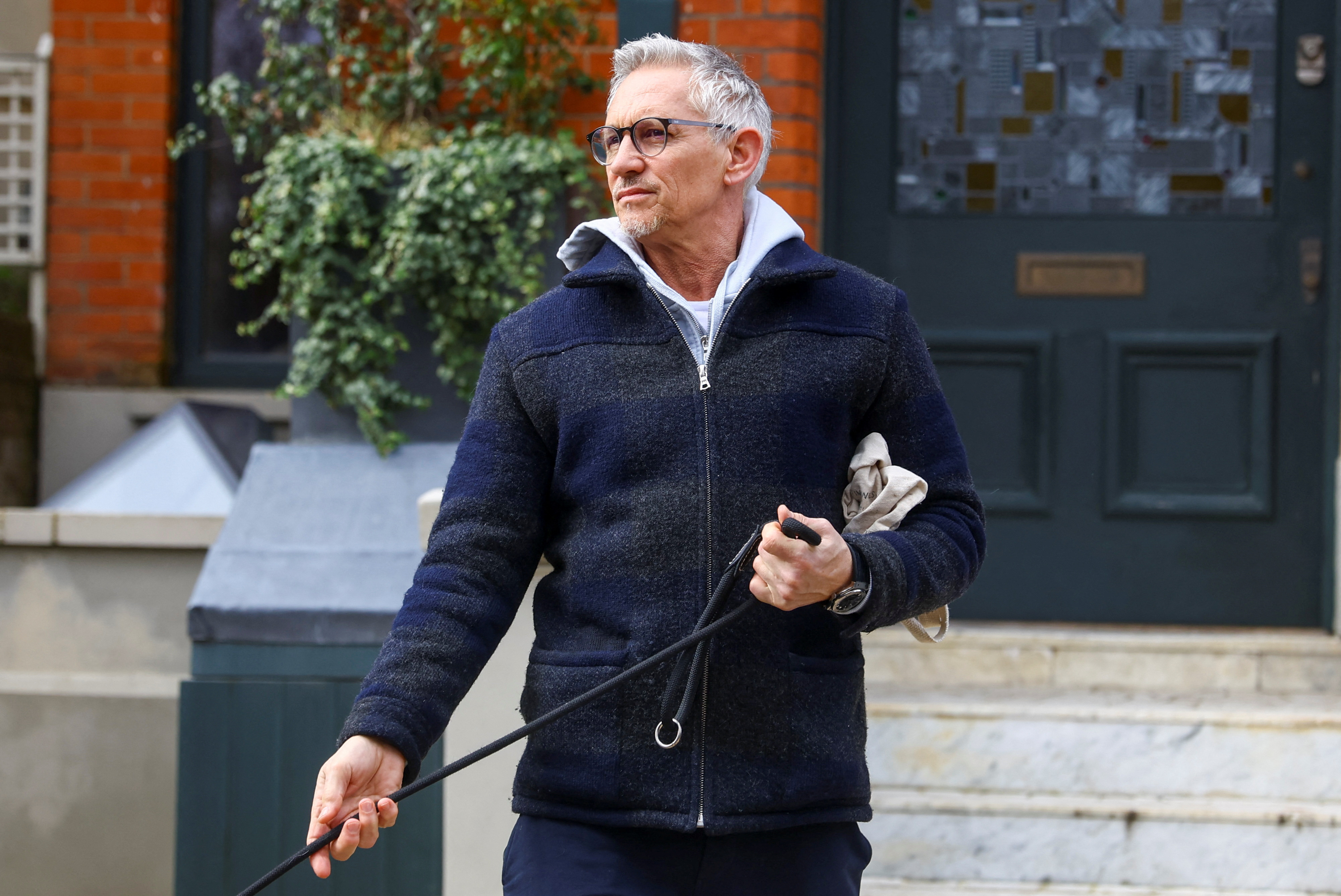 Football presenter Gary Lineker walks outside his home in London