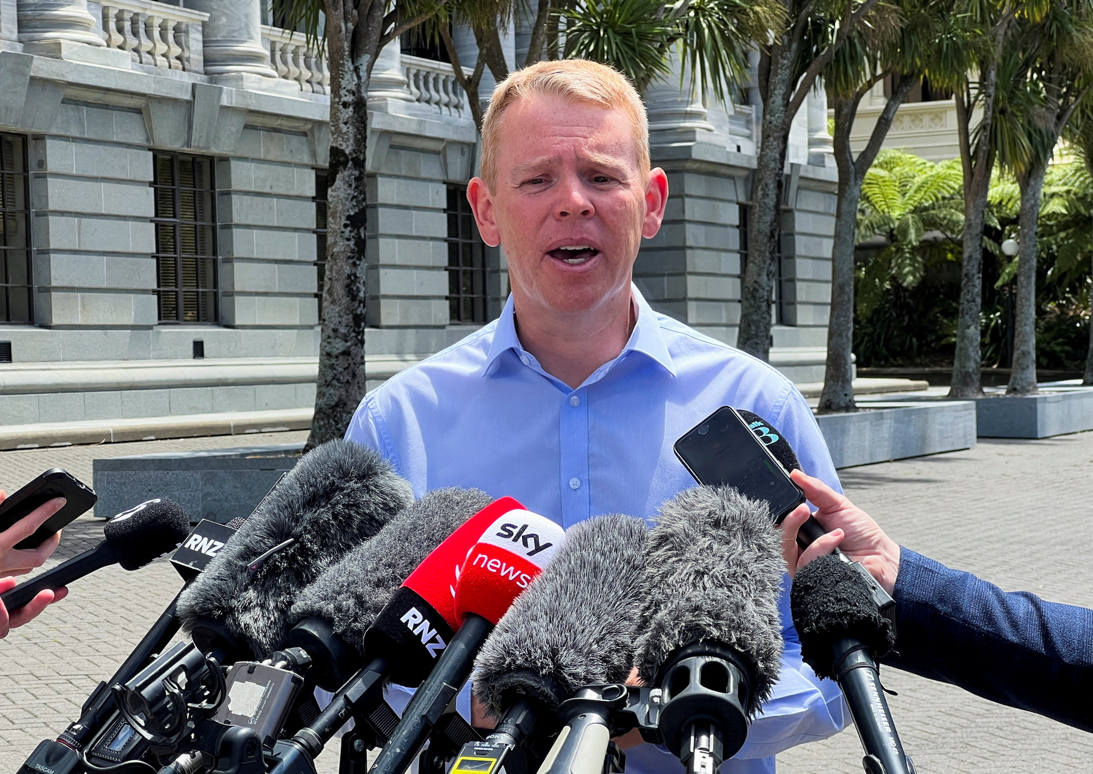 FILE PHOTO: Chris Hipkins speaks outside New Zealand's parliament in Wellington