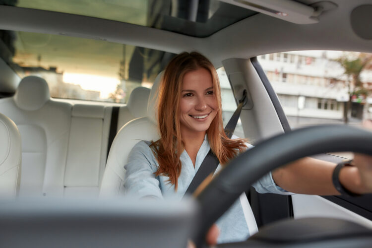 Portrait,Of,Smiling,Young,Caucasian,Woman,Sitting,Alone,On,Driver