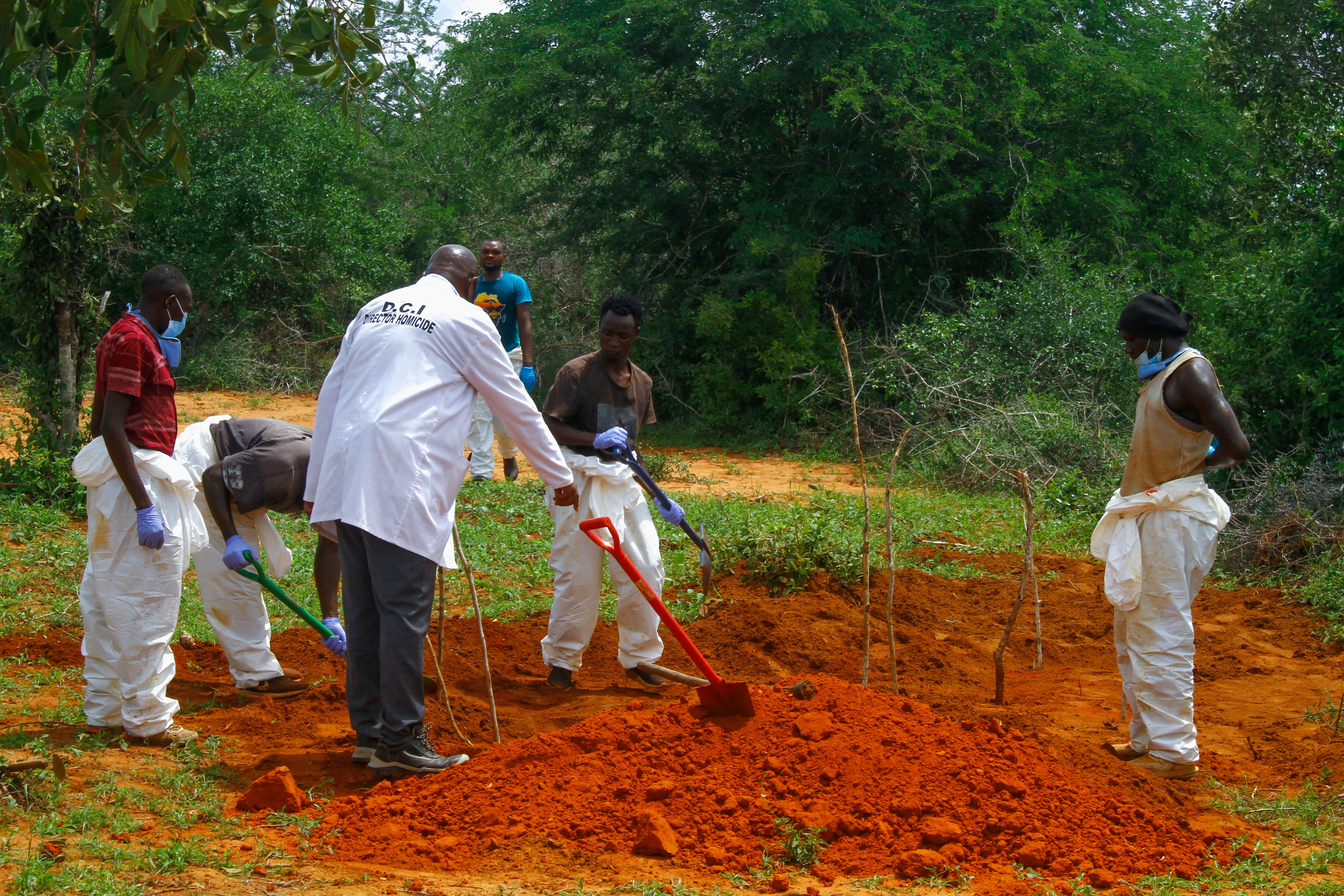 Kenya police exhume remains from suspected followers of a Christian cult from shallow graves in Kilifi