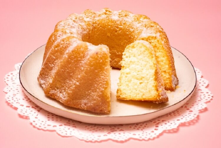 Yellow,Bundt,Cake,On,A,White,Plate,And,A,Lace