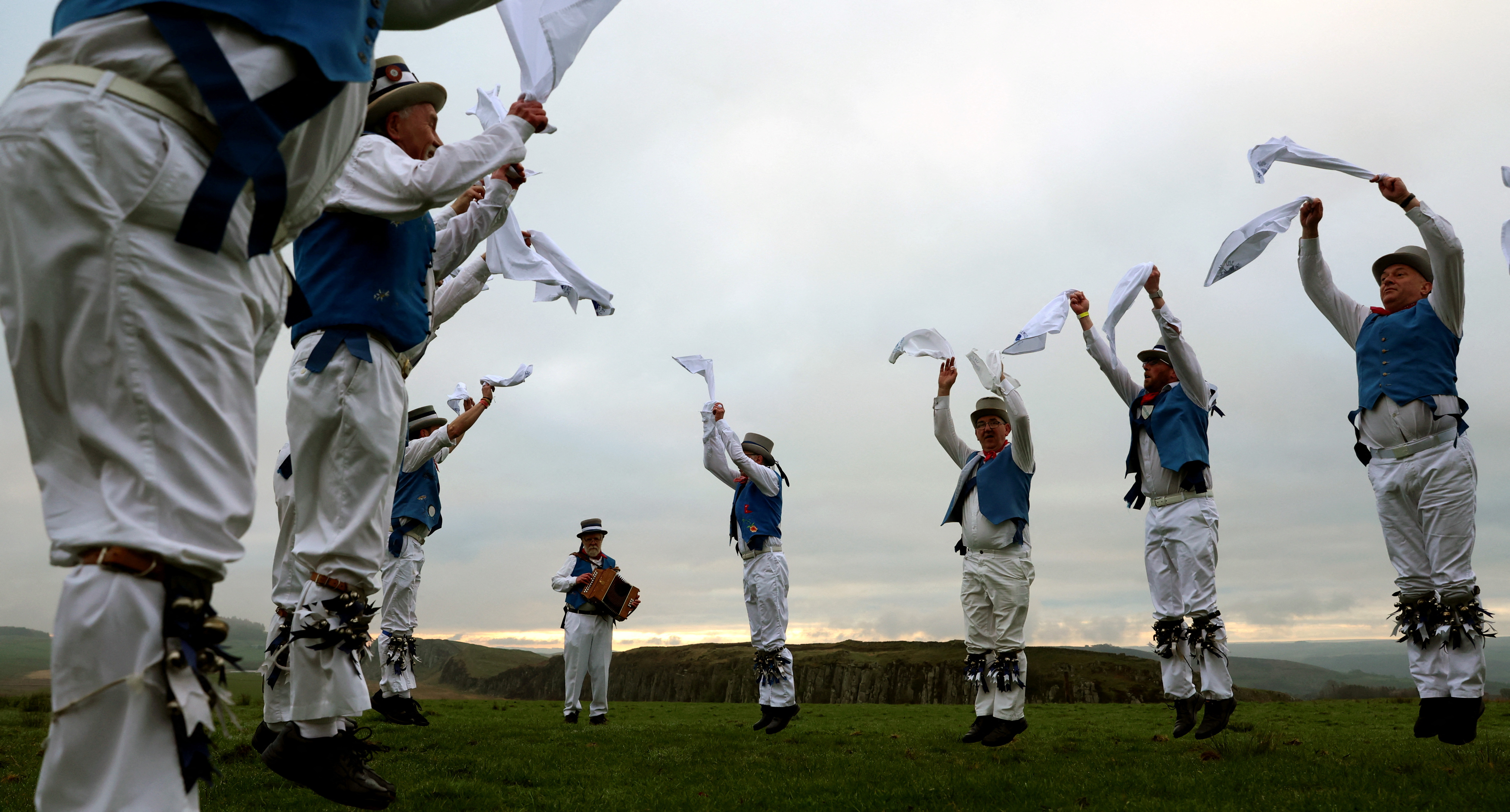 Members of Hexham Morrismen perform at sunrise to traditionally mark May Day in Henshaw