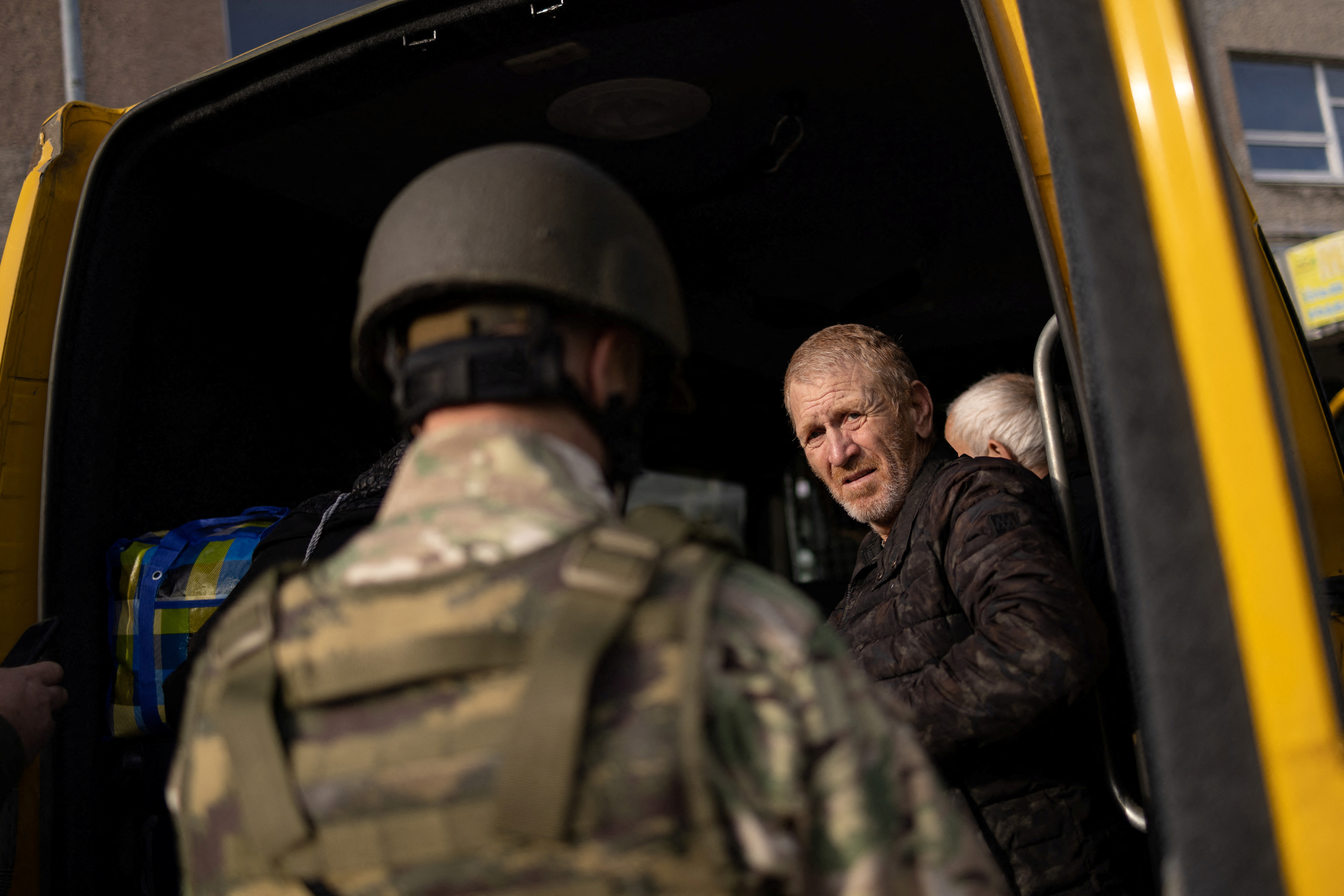 Local residents evacuate Kherson