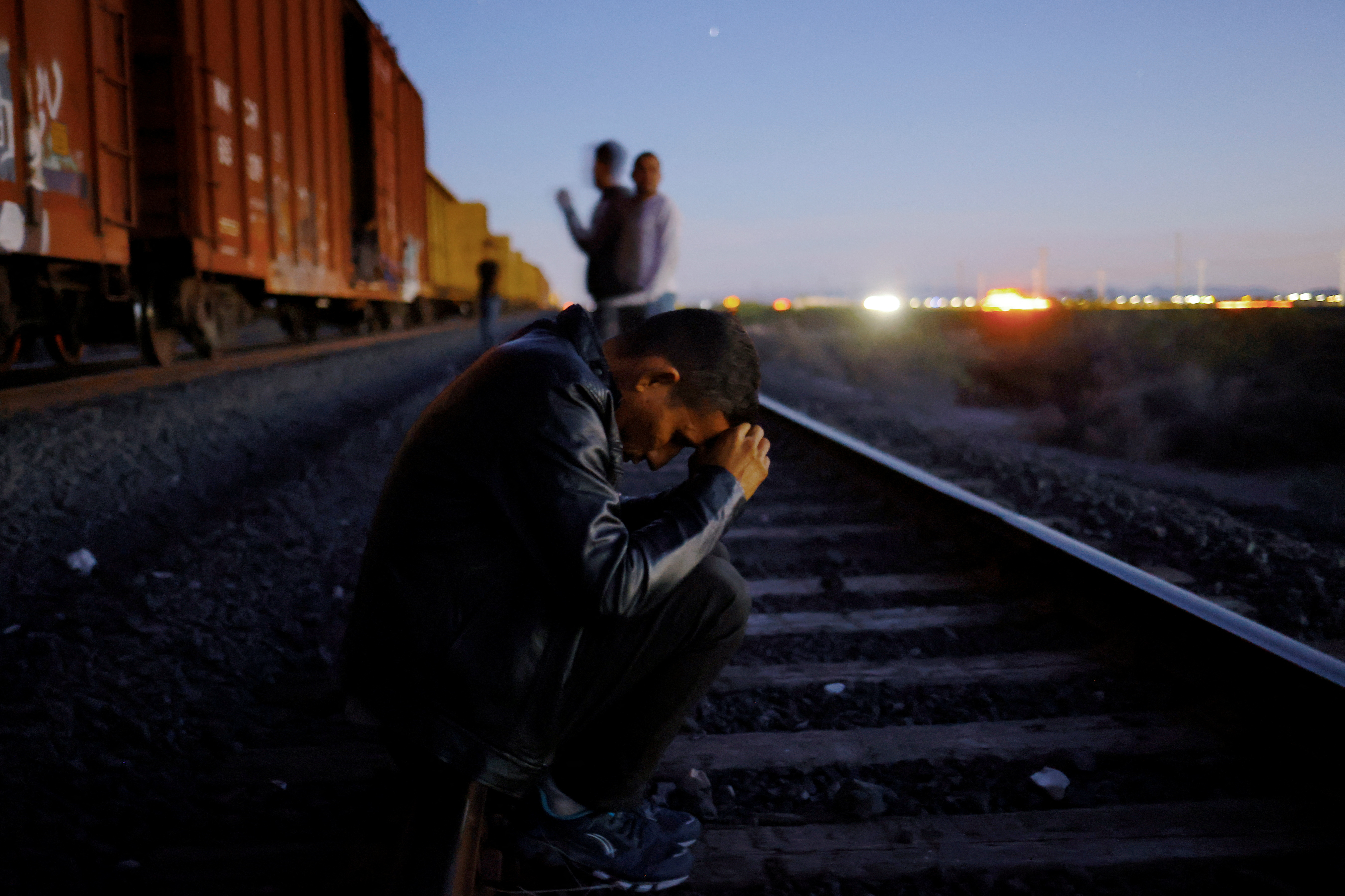 The Wider Image: Migrants risk life and limb to jump Mexico trains in rush to border