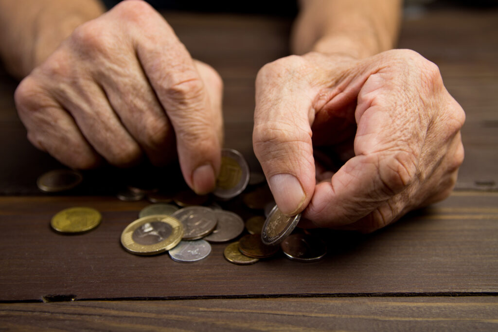 Hands,Of,Beggar,With,Few,Coins.,The,Concept,Of,Poverty