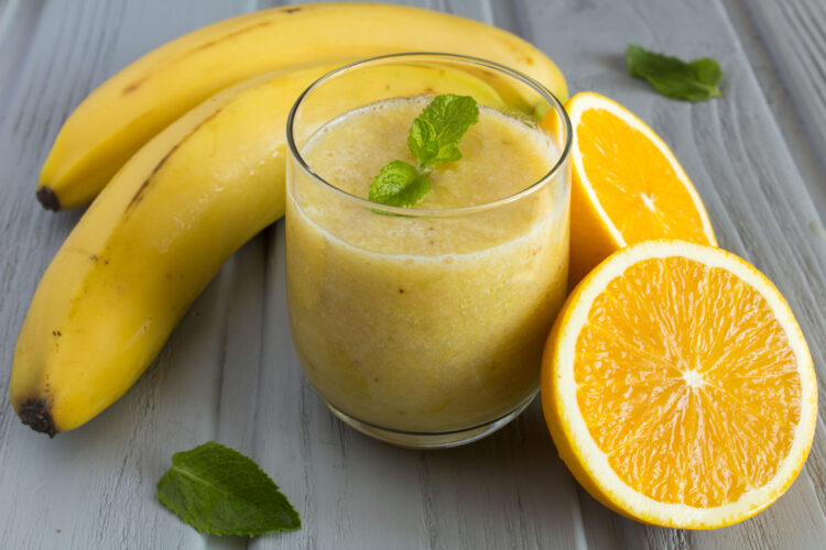 Smoothie,From,Banana,And,Orange,On,The,Grey,Wooden,Background