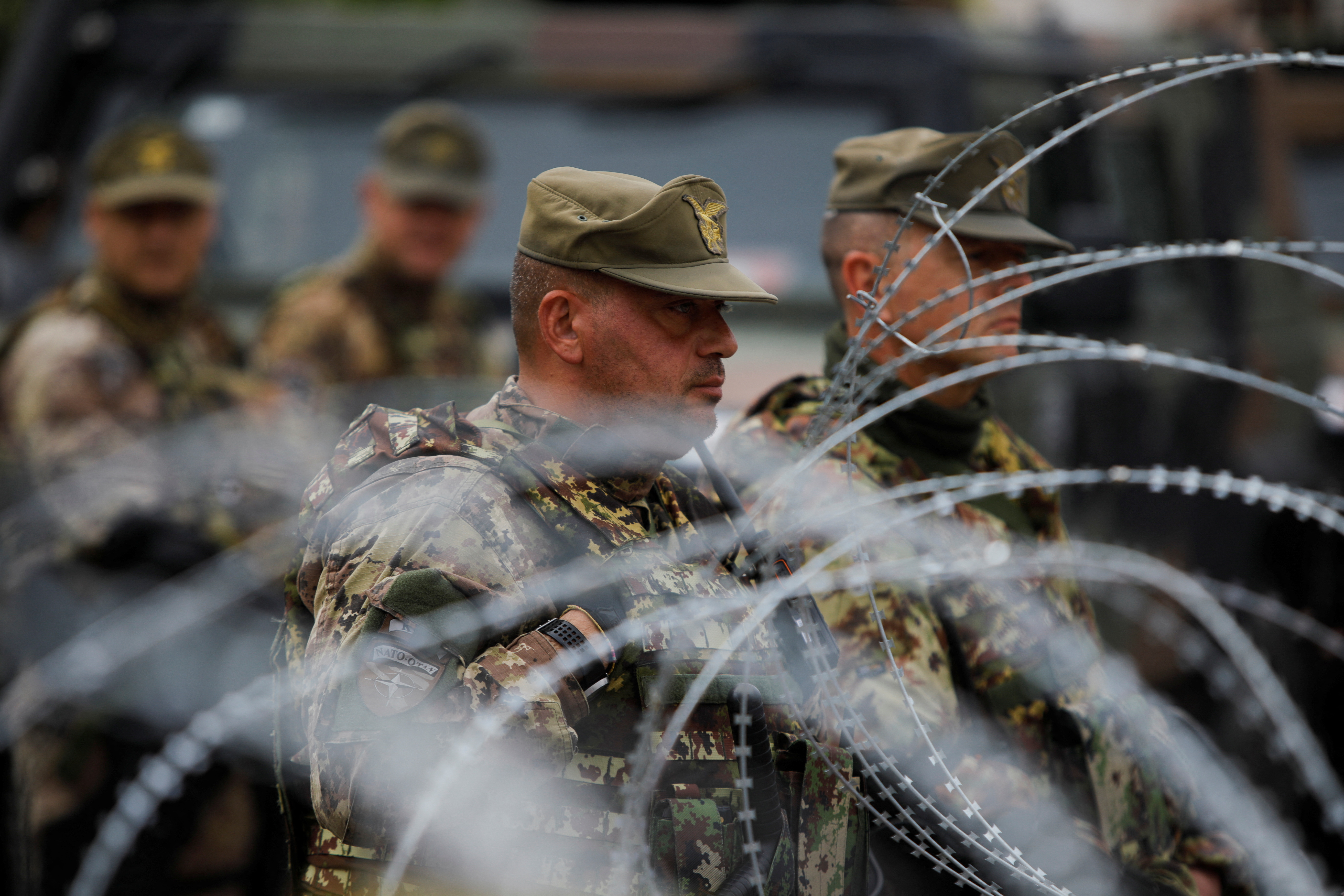 Members of the NATO-led Kosovo Force (KFOR) stand guard in Leposavic