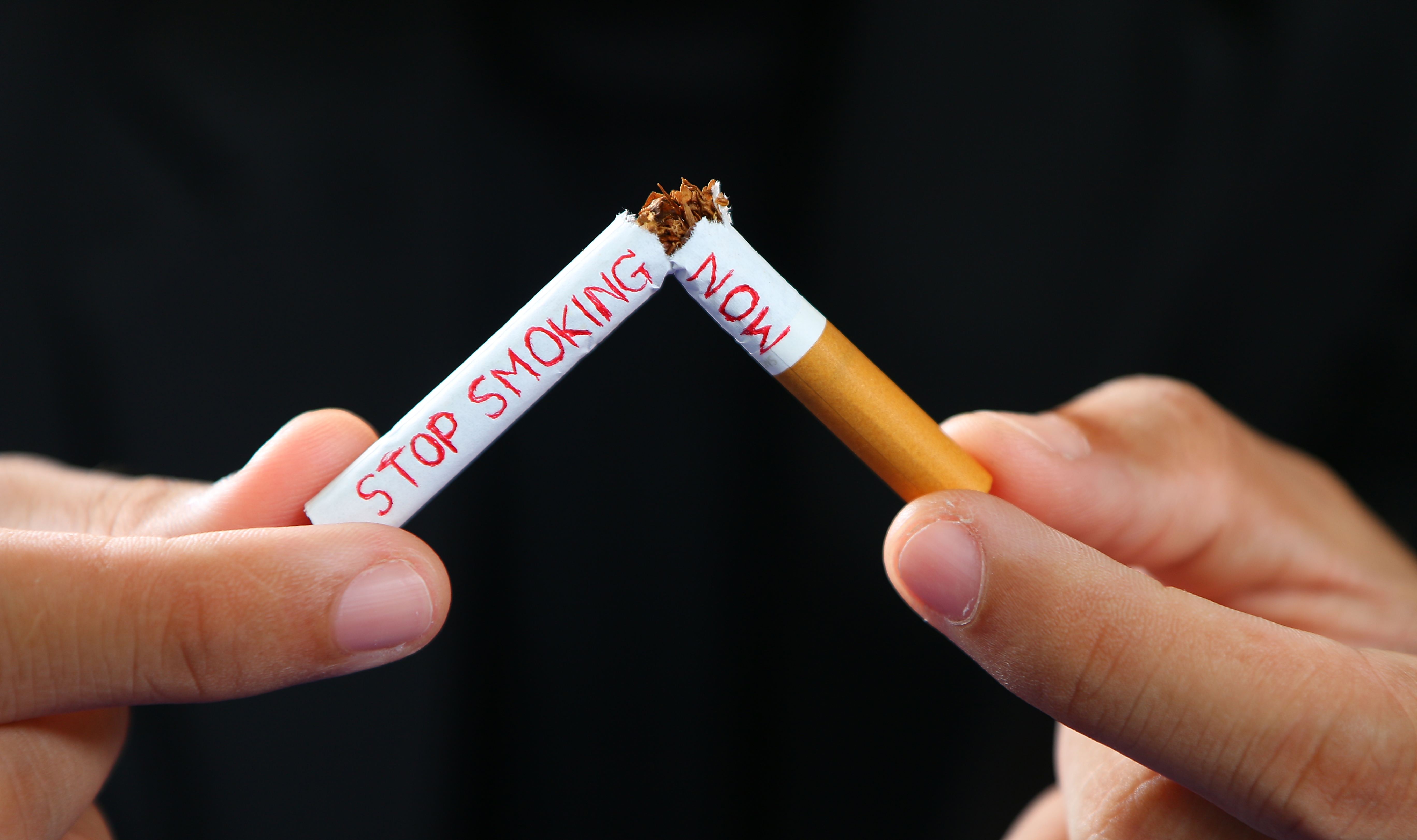 Man,Holding,A,Cigarette,In,His,Hand,And,Then,Broken