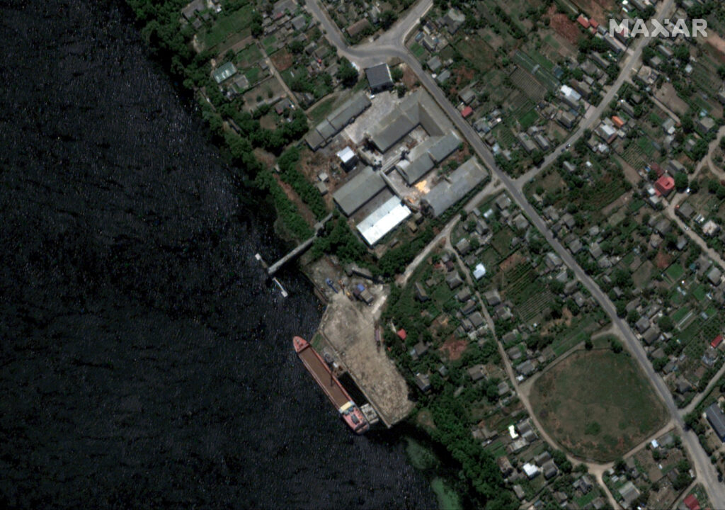 A satellite image shows extensive flooding along the Dnipro River