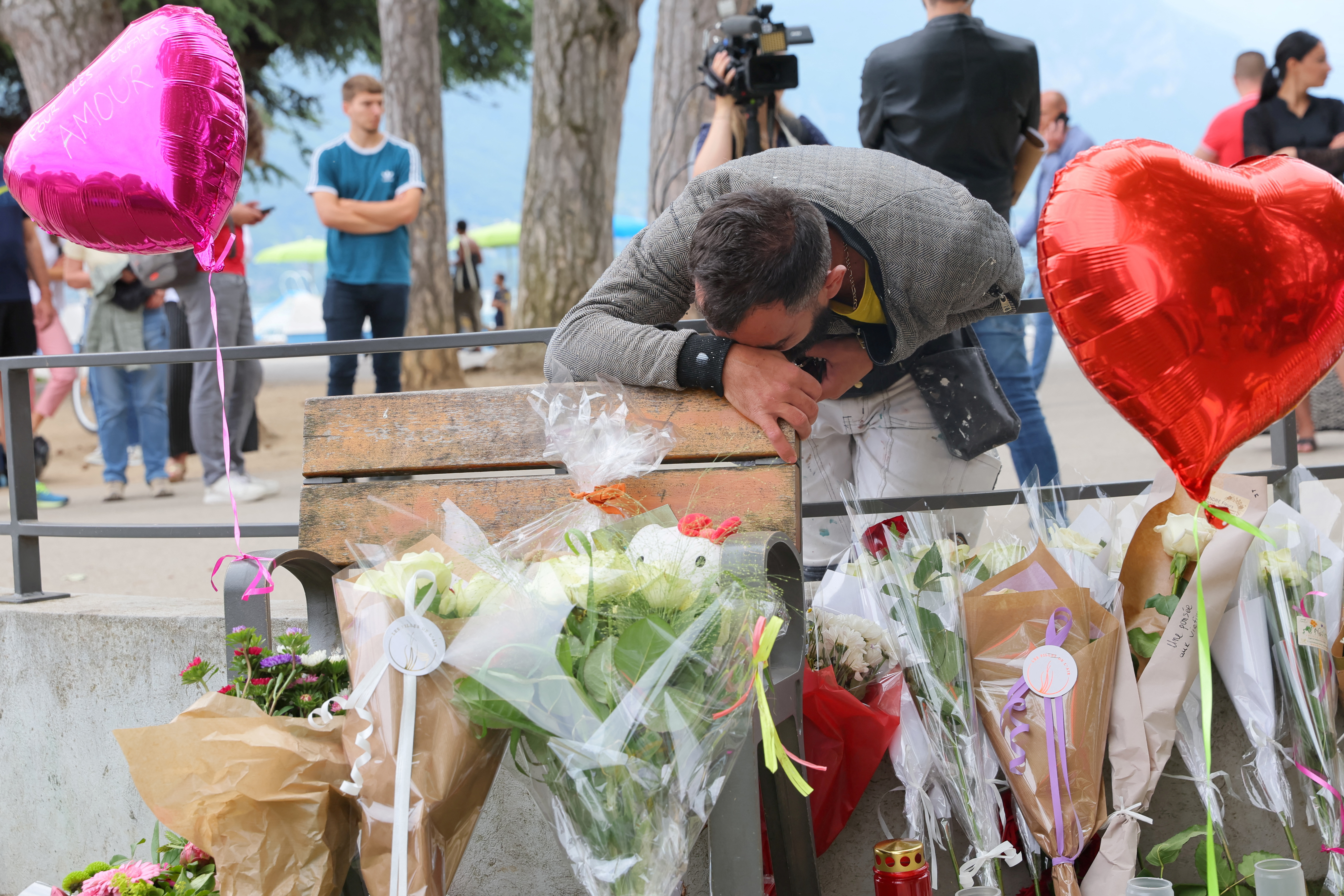 Tribute for victims the day after knife attack in French alpine town of Annecy