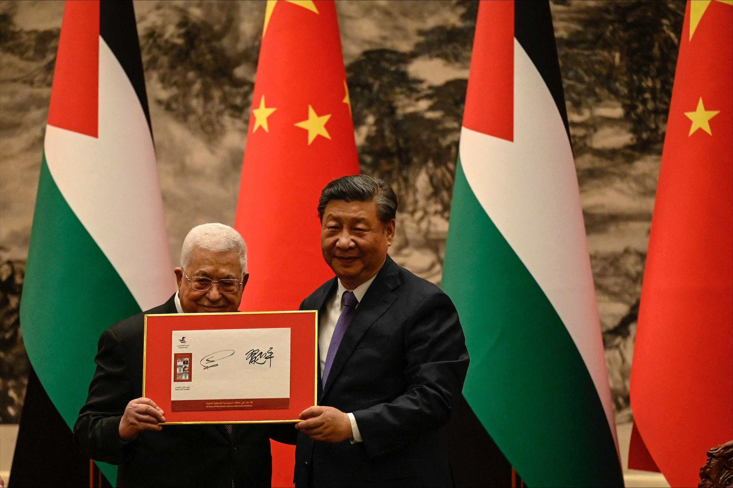 China's President Xi Jinping and Palestinian President Abbas attend a signing ceremony at the Great Hall of the People in Beijing